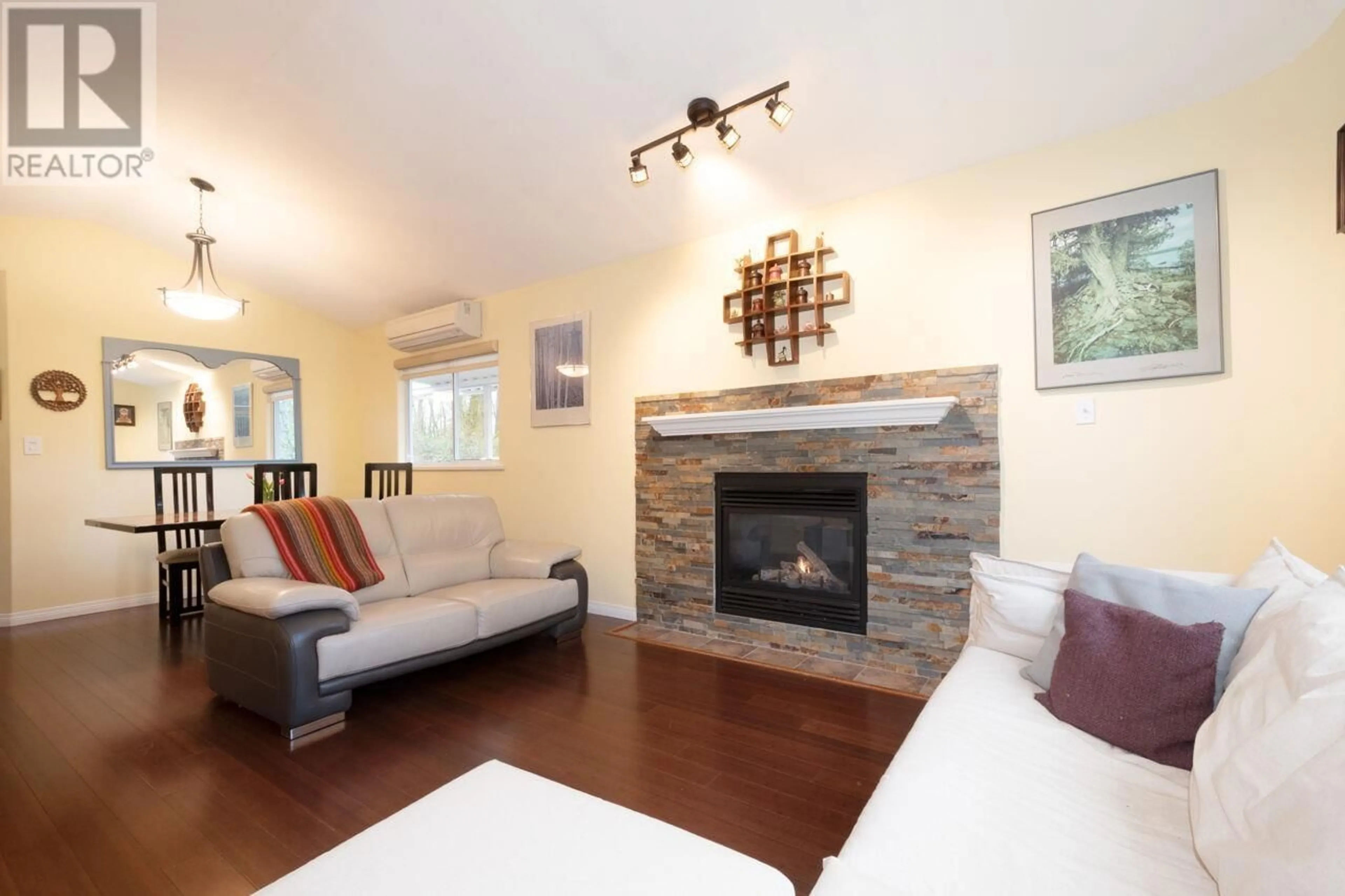 Living room with furniture, wood/laminate floor for 6873 4TH STREET, Burnaby British Columbia V5E4J3
