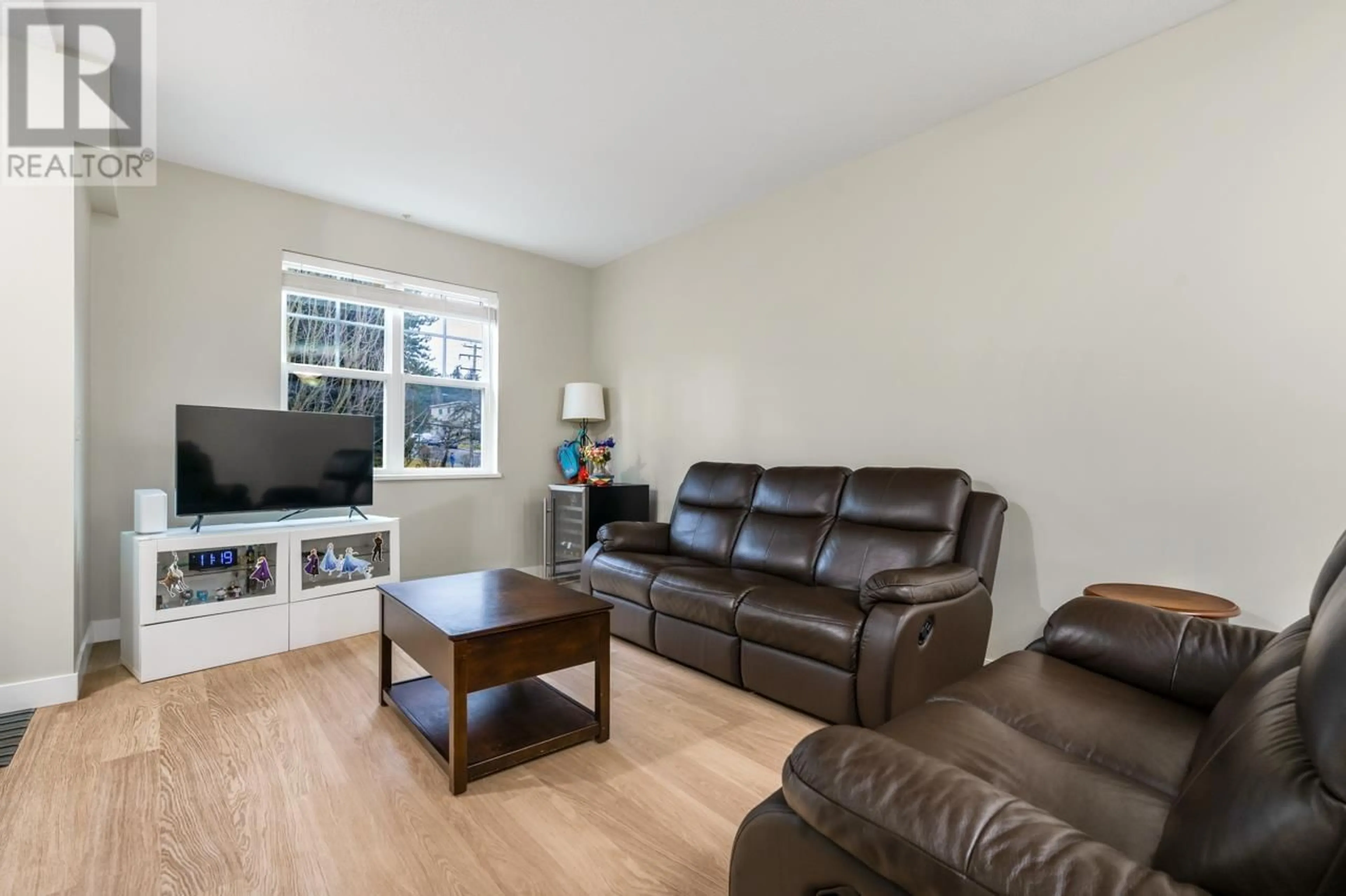 Living room with furniture, unknown for 203 - 4135 SARDIS STREET, Burnaby British Columbia V5H1K3