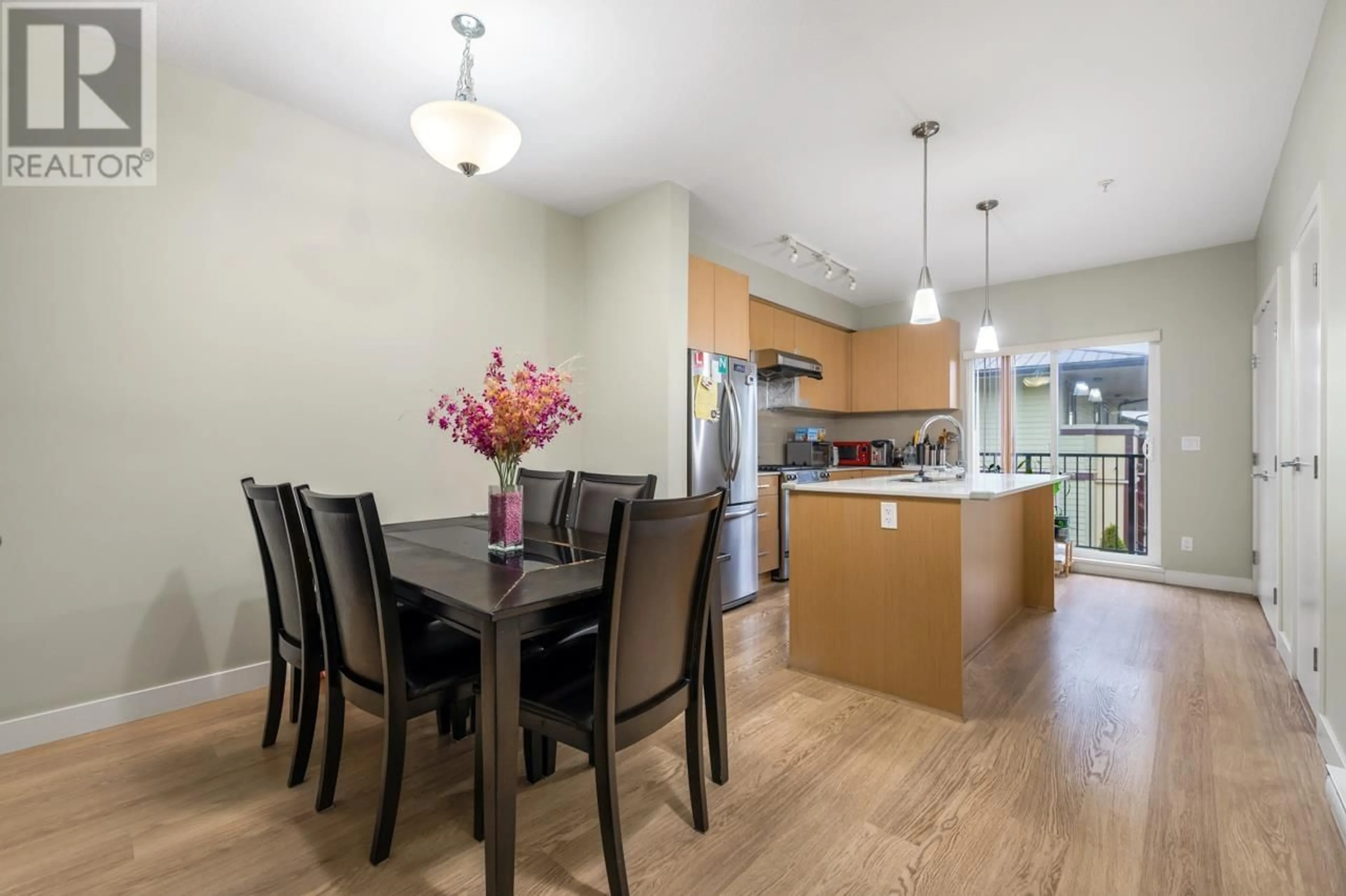 Open concept kitchen, wood/laminate floor for 203 - 4135 SARDIS STREET, Burnaby British Columbia V5H1K3