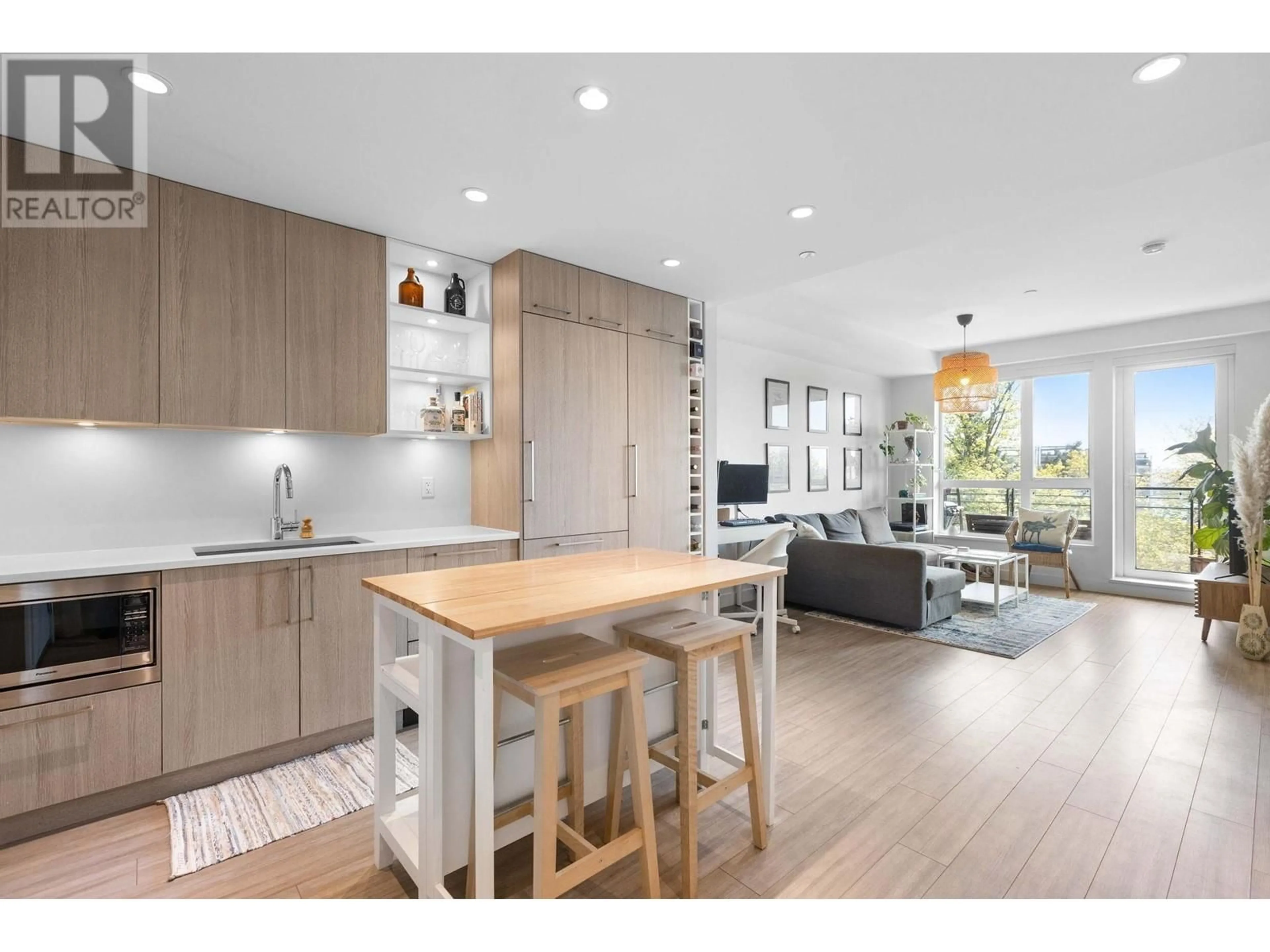 Open concept kitchen, wood/laminate floor for 309 - 747 3RD STREET, North Vancouver British Columbia V7L1G8