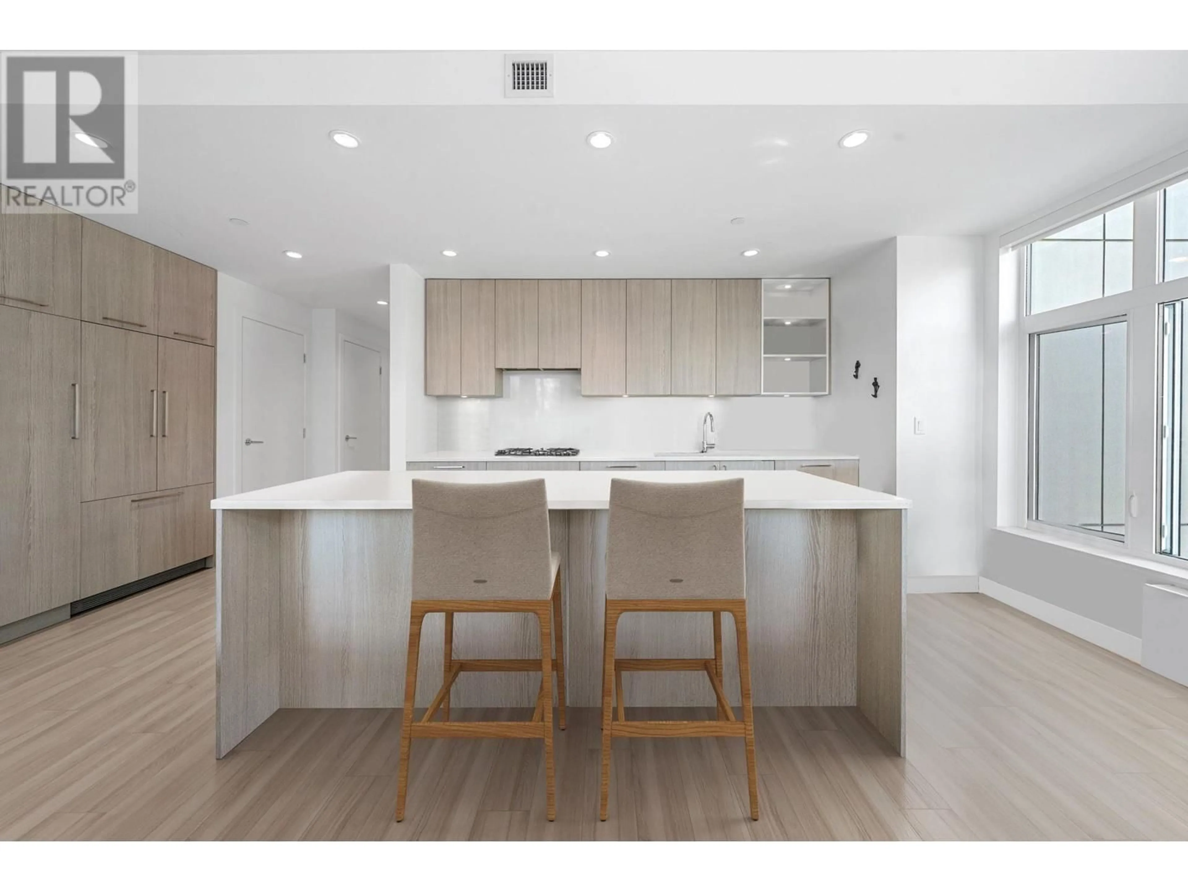 Open concept kitchen, wood/laminate floor for 211 - 747 3RD STREET, North Vancouver British Columbia V7L1G8