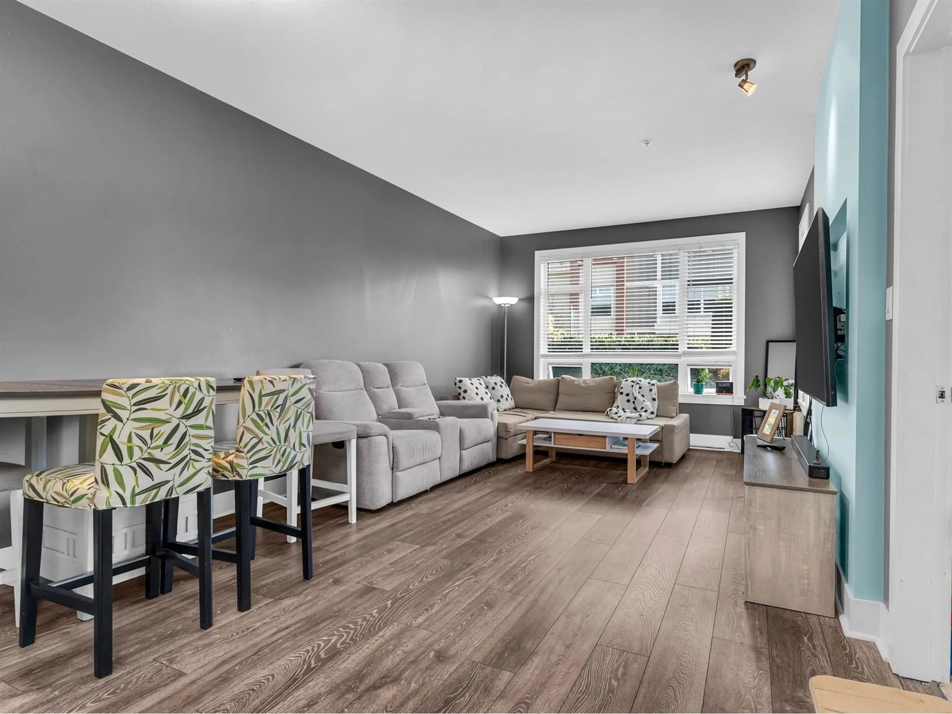 Living room with furniture, wood/laminate floor for A119 - 20211 66, Langley British Columbia V2Y0L4