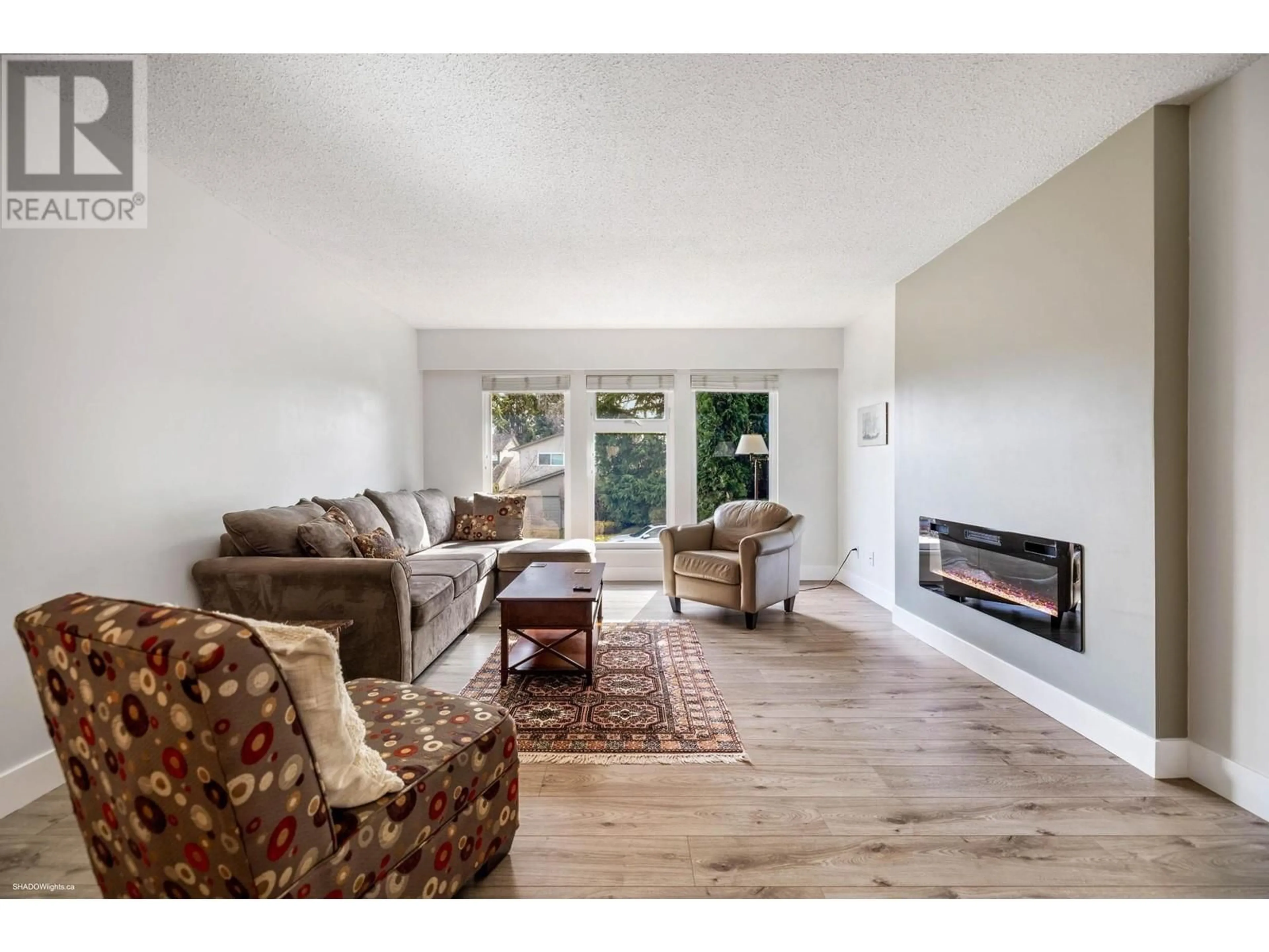 Living room with furniture, wood/laminate floor for 4171 CAMPOBELLO PLACE, Richmond British Columbia V7E5G5