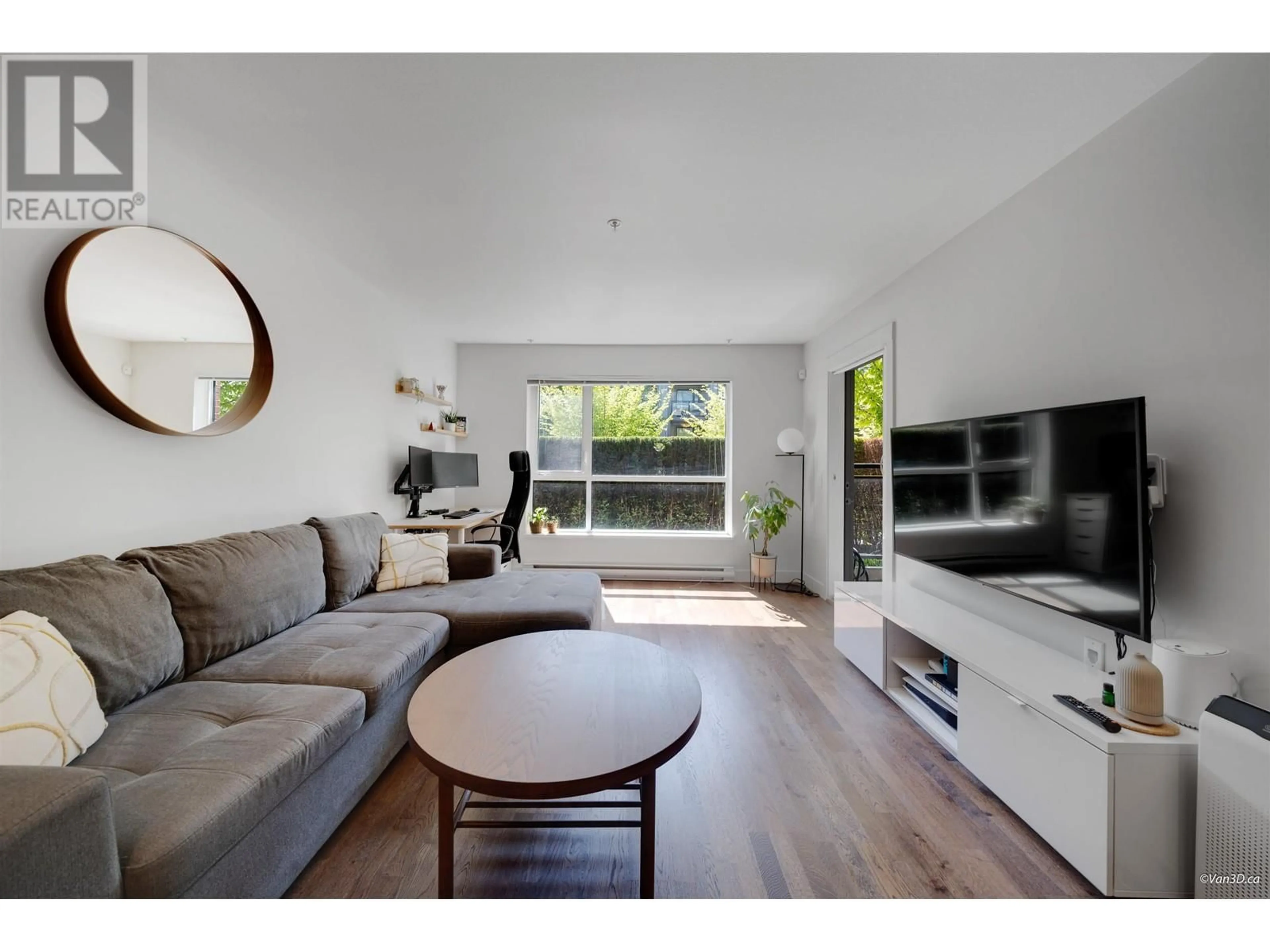 Living room with furniture, wood/laminate floor for 103 - 7088 14TH AVENUE, Burnaby British Columbia V3N0E7