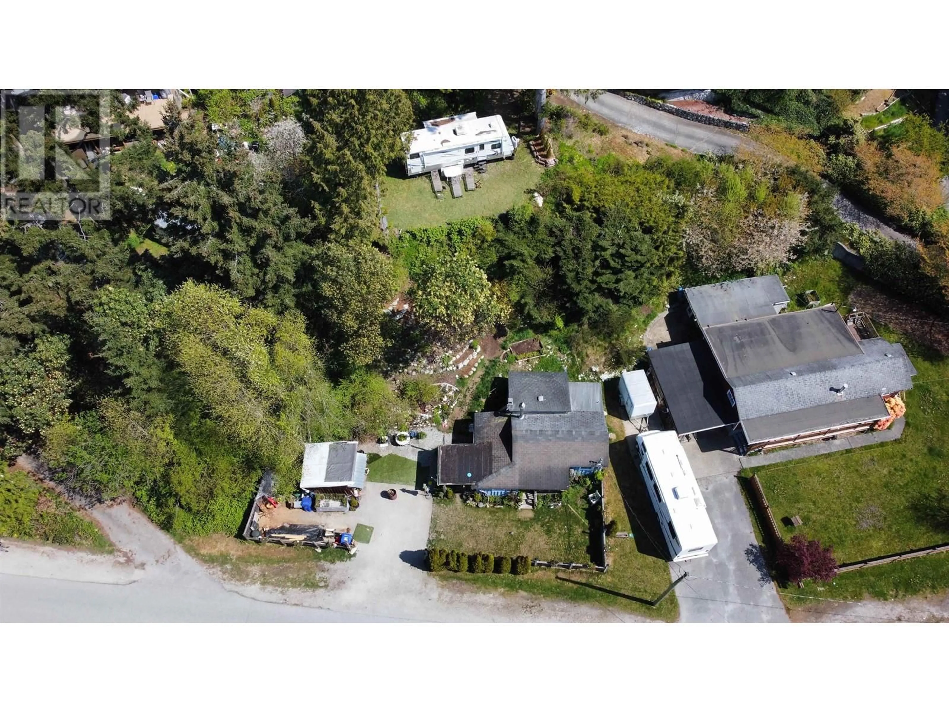 A pic from outside/outdoor area/front of a property/back of a property/a pic from drone, street for 4604 WHITAKER, Sechelt British Columbia V7Z0E4