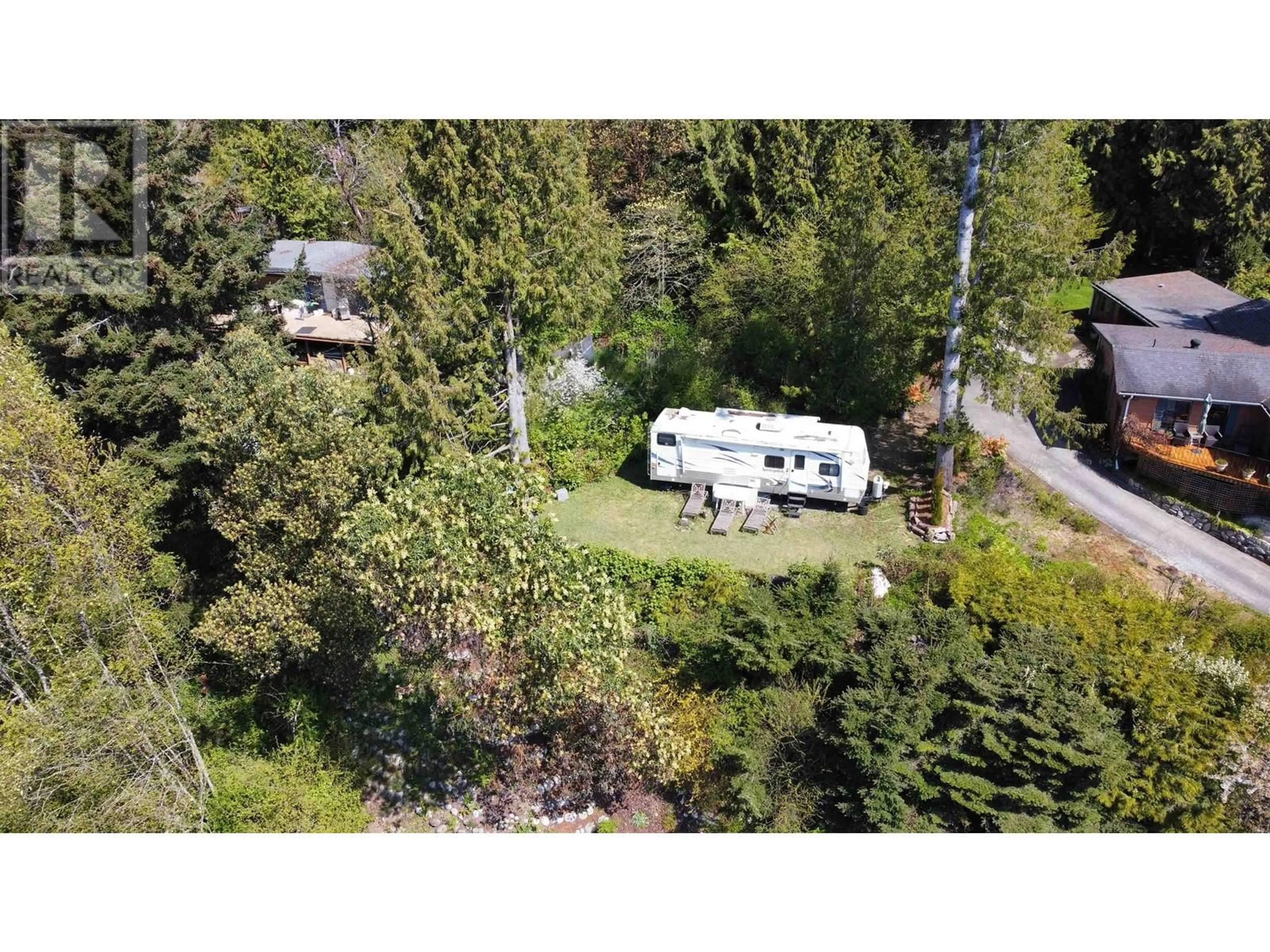 A pic from outside/outdoor area/front of a property/back of a property/a pic from drone, forest/trees view for 4604 WHITAKER, Sechelt British Columbia V7Z0E4