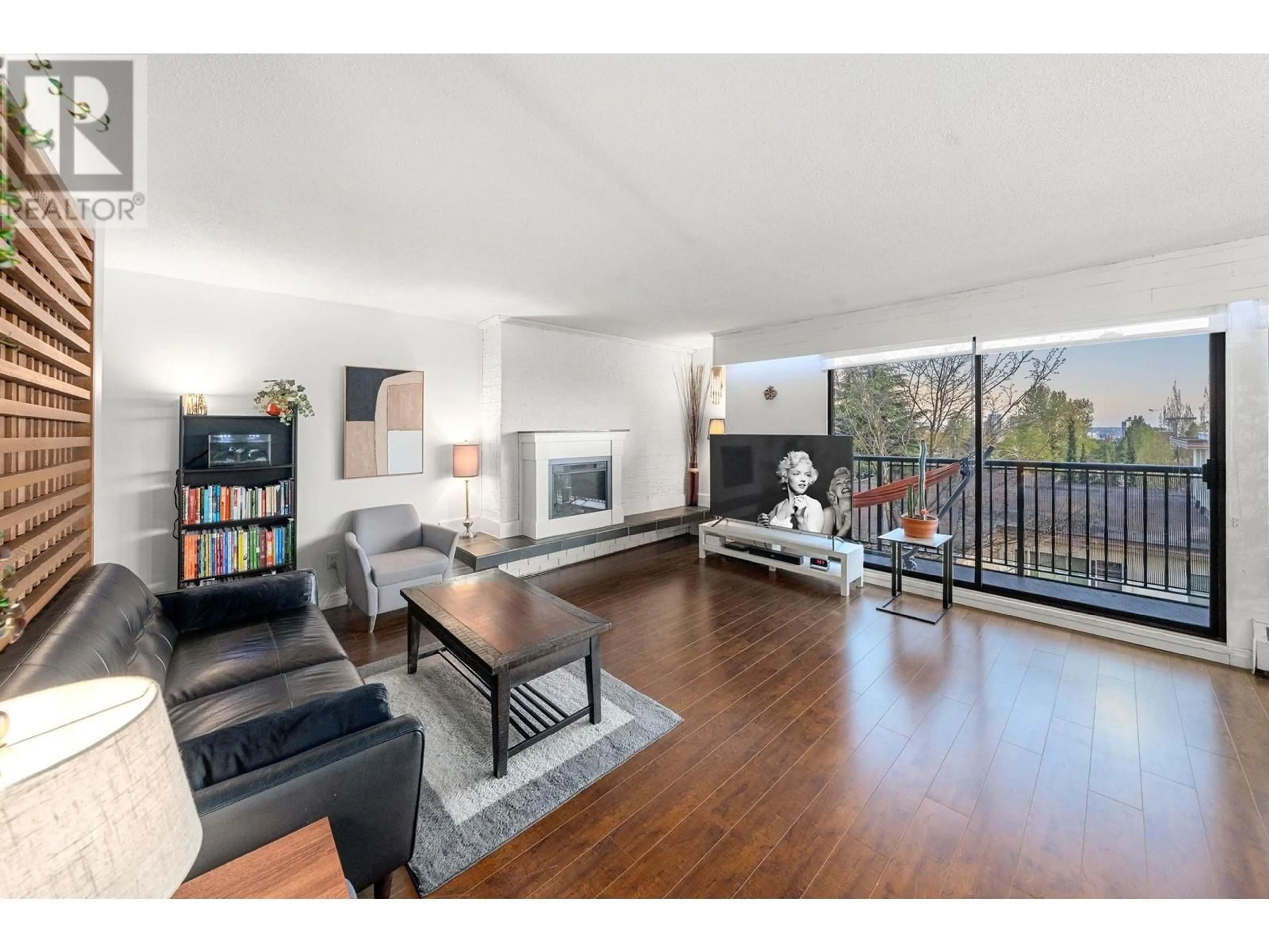 Living room with furniture, wood/laminate floor for 302 - 2545 LONSDALE AVENUE, North Vancouver British Columbia V7N3H7