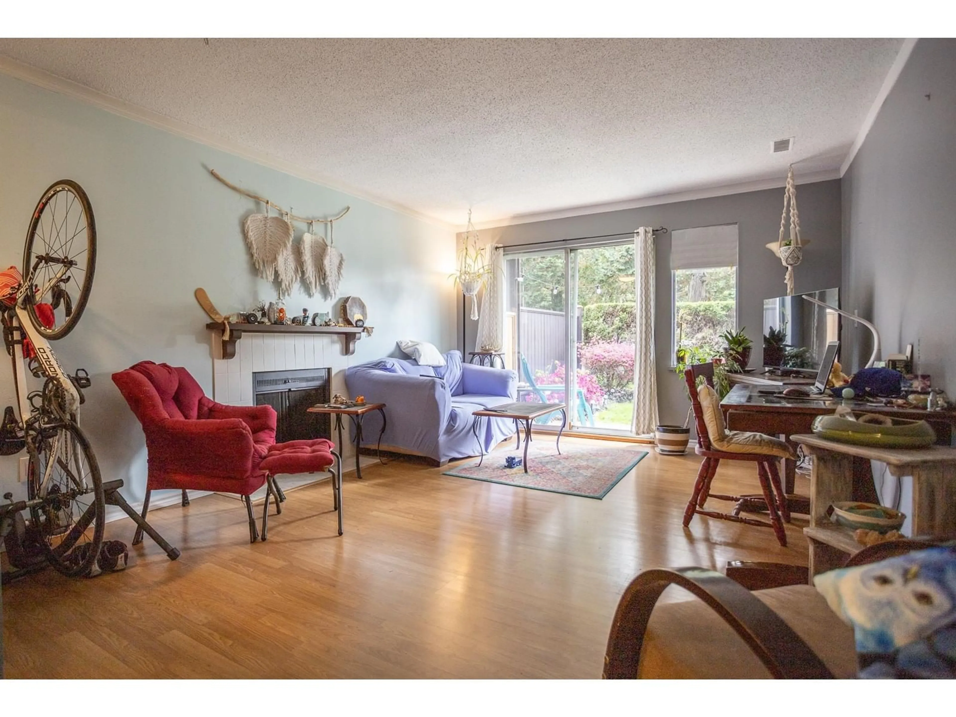 Living room with furniture, wood/laminate floor for 1312 - 34909 OLD YALE, Abbotsford British Columbia V3G2E7