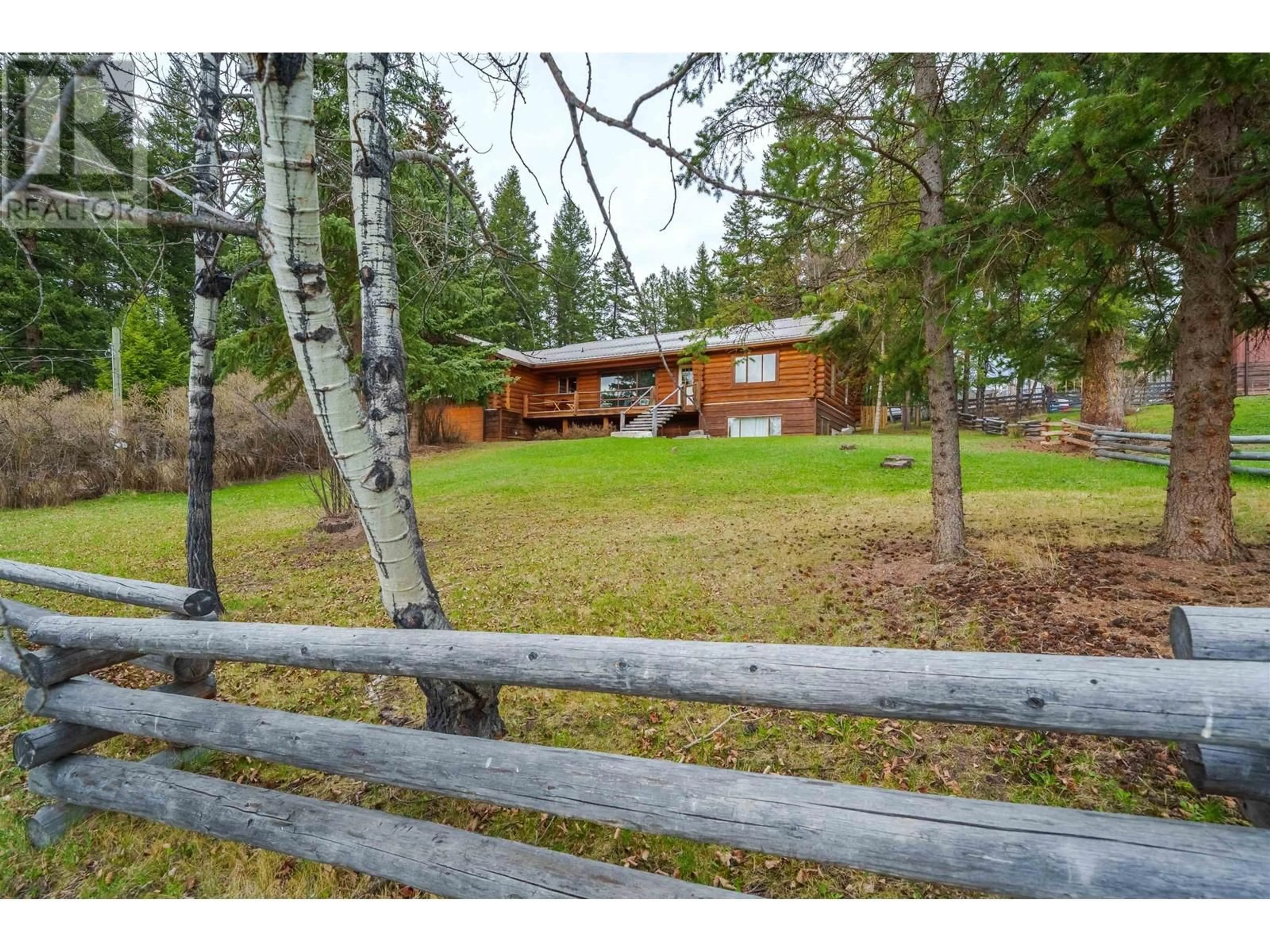 A pic from outside/outdoor area/front of a property/back of a property/a pic from drone, forest/trees view for 5172 KALLUM DRIVE, 108 Mile Ranch British Columbia V0K2Z0
