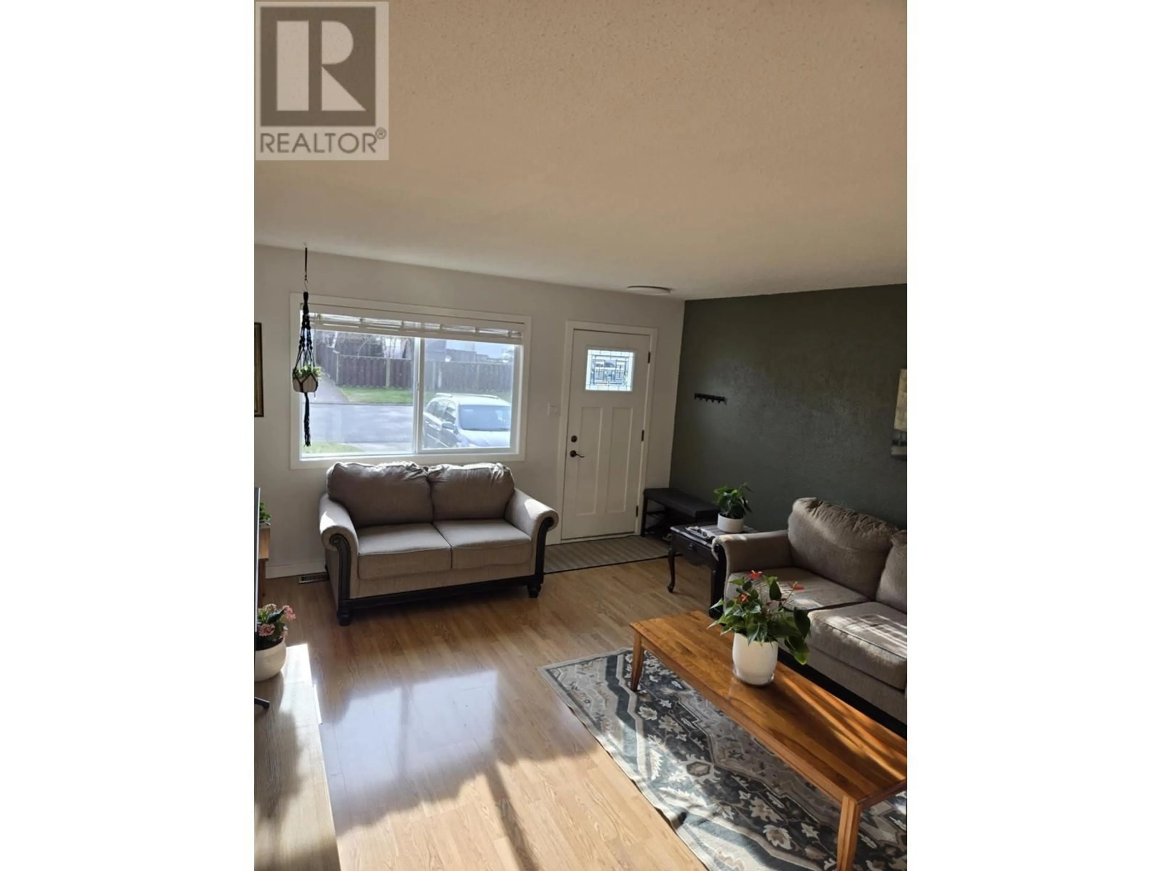 Living room with furniture, wood/laminate floor for 1413 DRUMMOND STREET, Prince George British Columbia V2M4J2