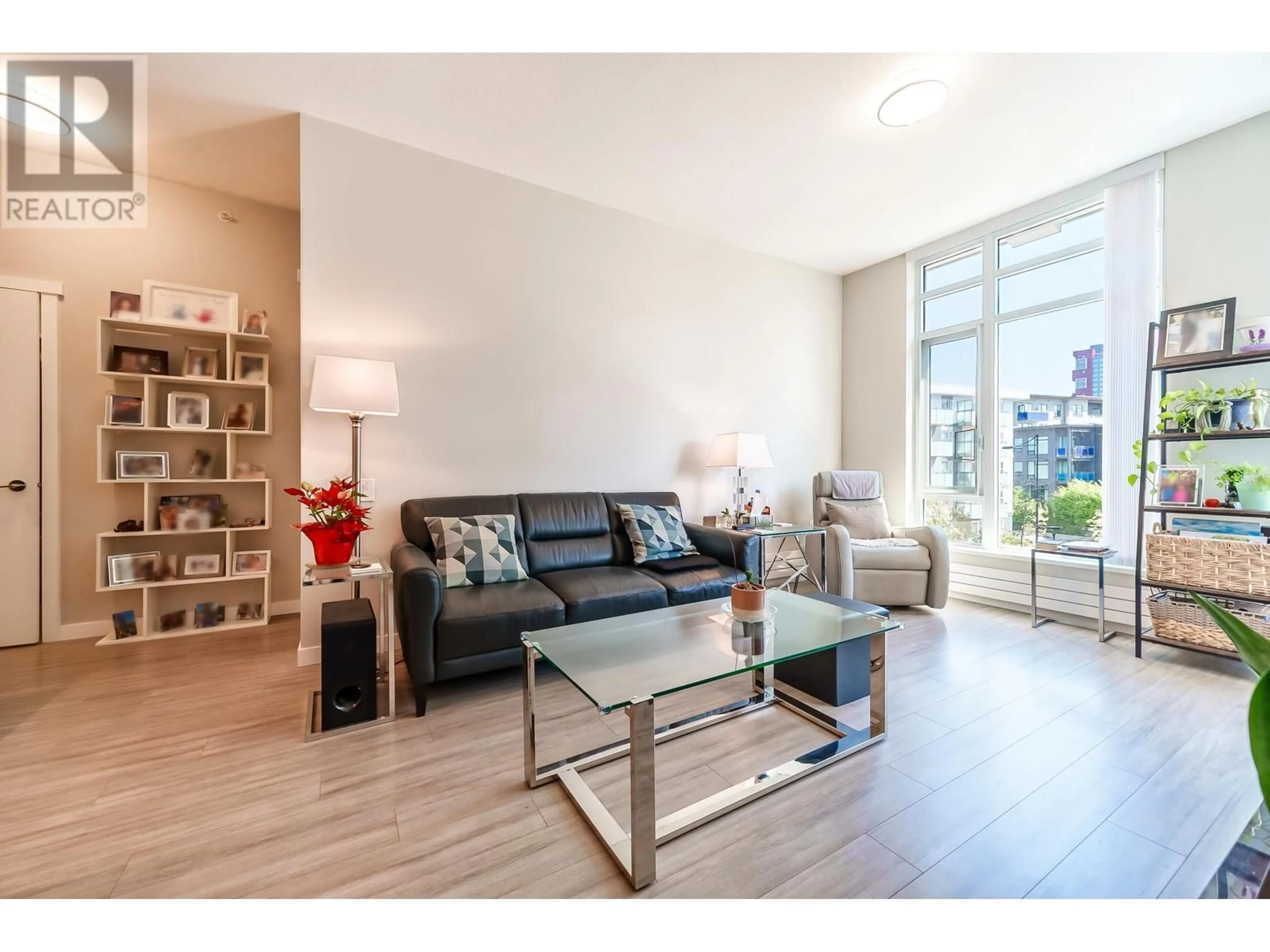 Living room with furniture, wood/laminate floor for 301 - 3188 RIVERWALK AVENUE, Vancouver British Columbia V5S0E7