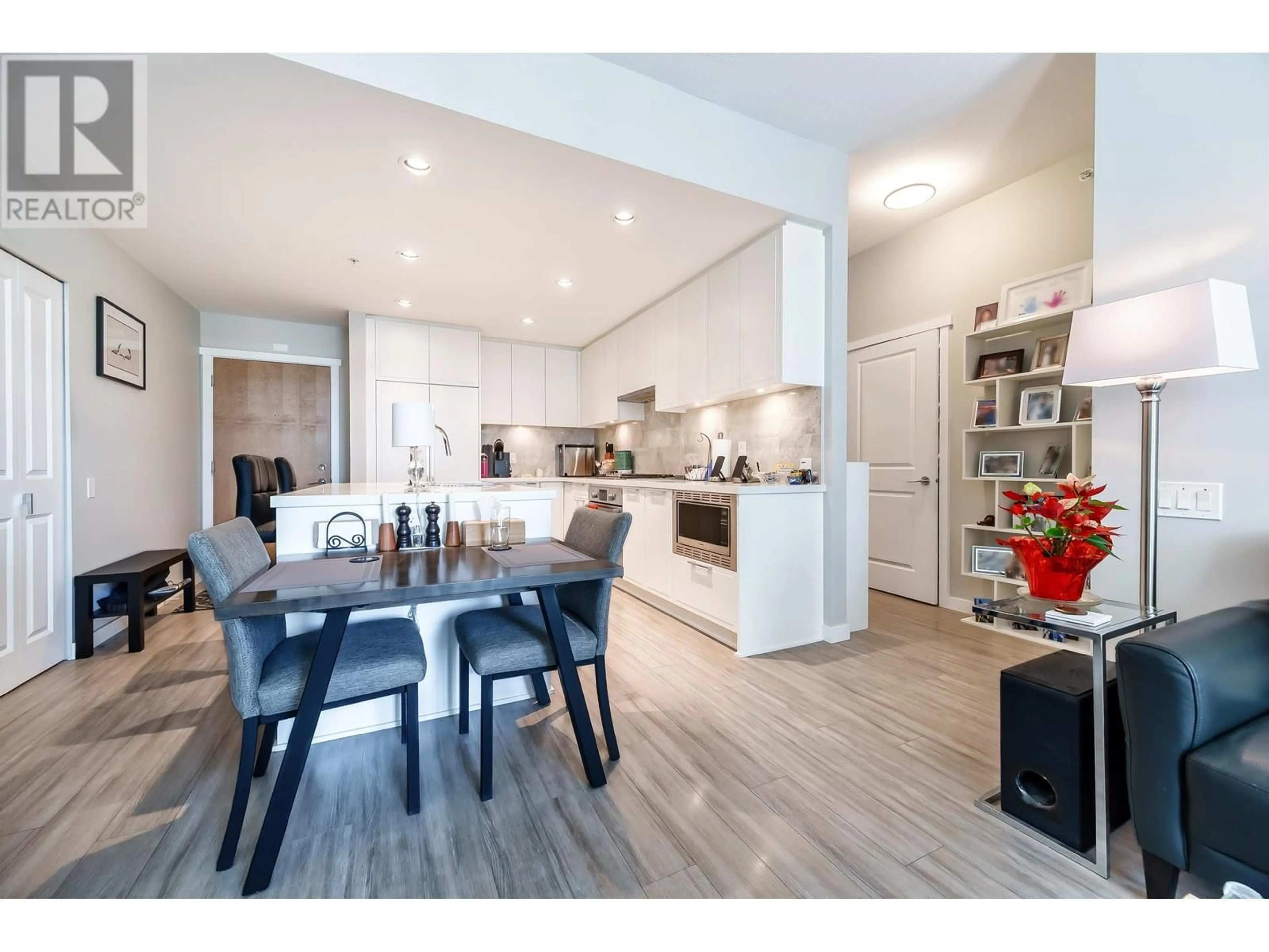Open concept kitchen, wood/laminate floor for 301 - 3188 RIVERWALK AVENUE, Vancouver British Columbia V5S0E7
