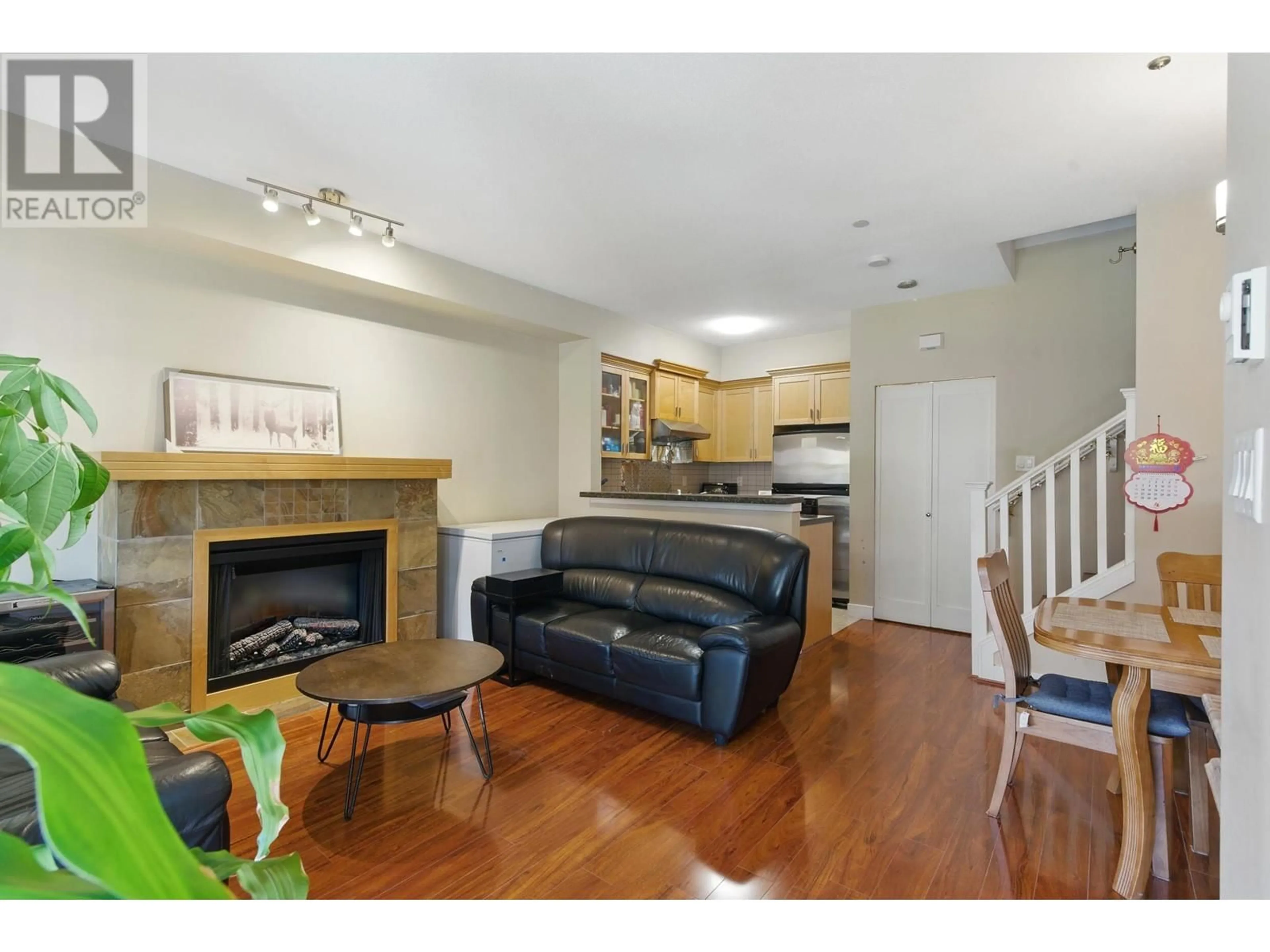 Living room with furniture, wood/laminate floor for 45 - 7388 MACPHERSON AVENUE, Burnaby British Columbia V5J0A1