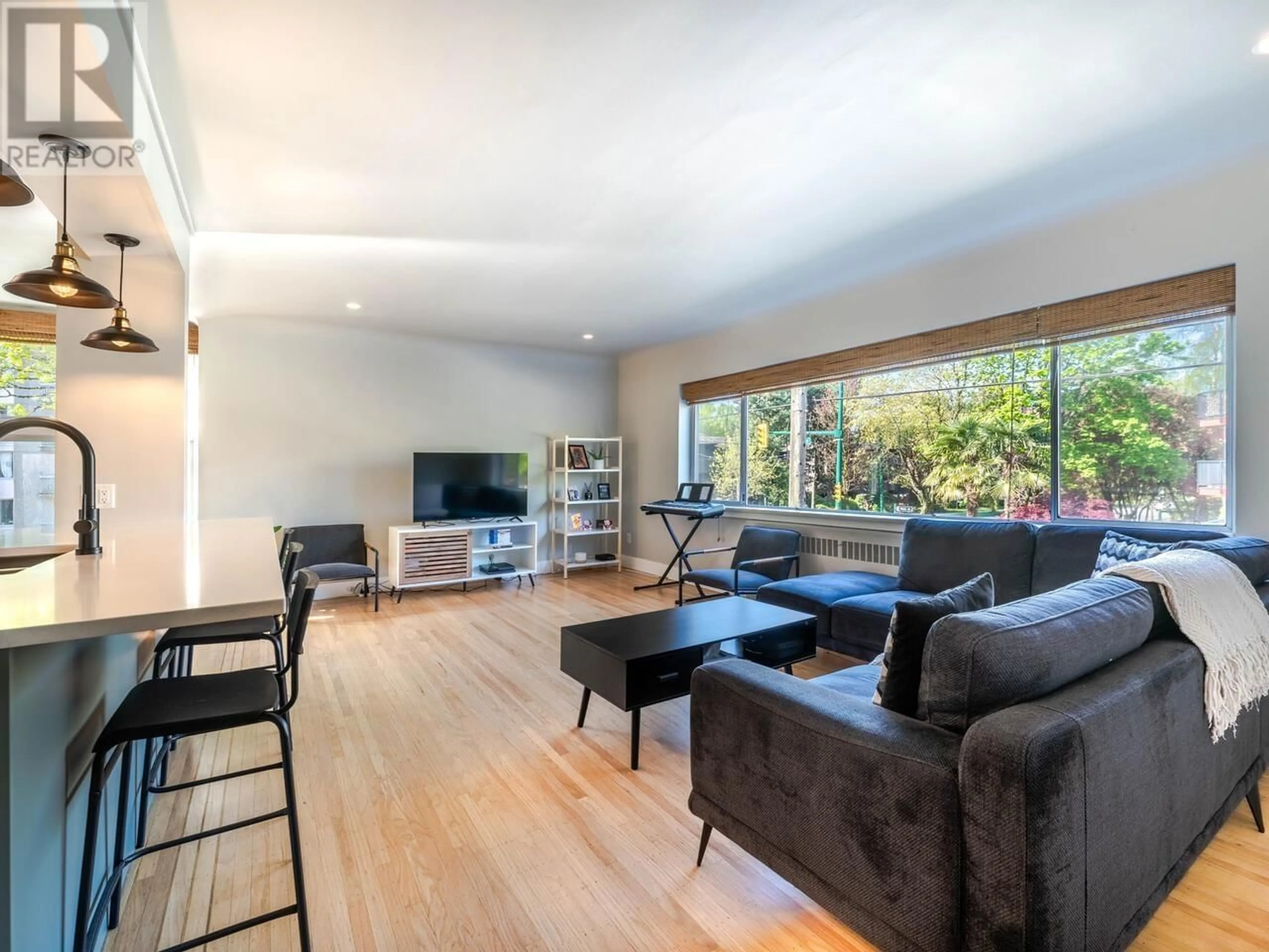 Living room with furniture, wood/laminate floor for 103 - 2776 PINE STREET, Vancouver British Columbia V6J3G2