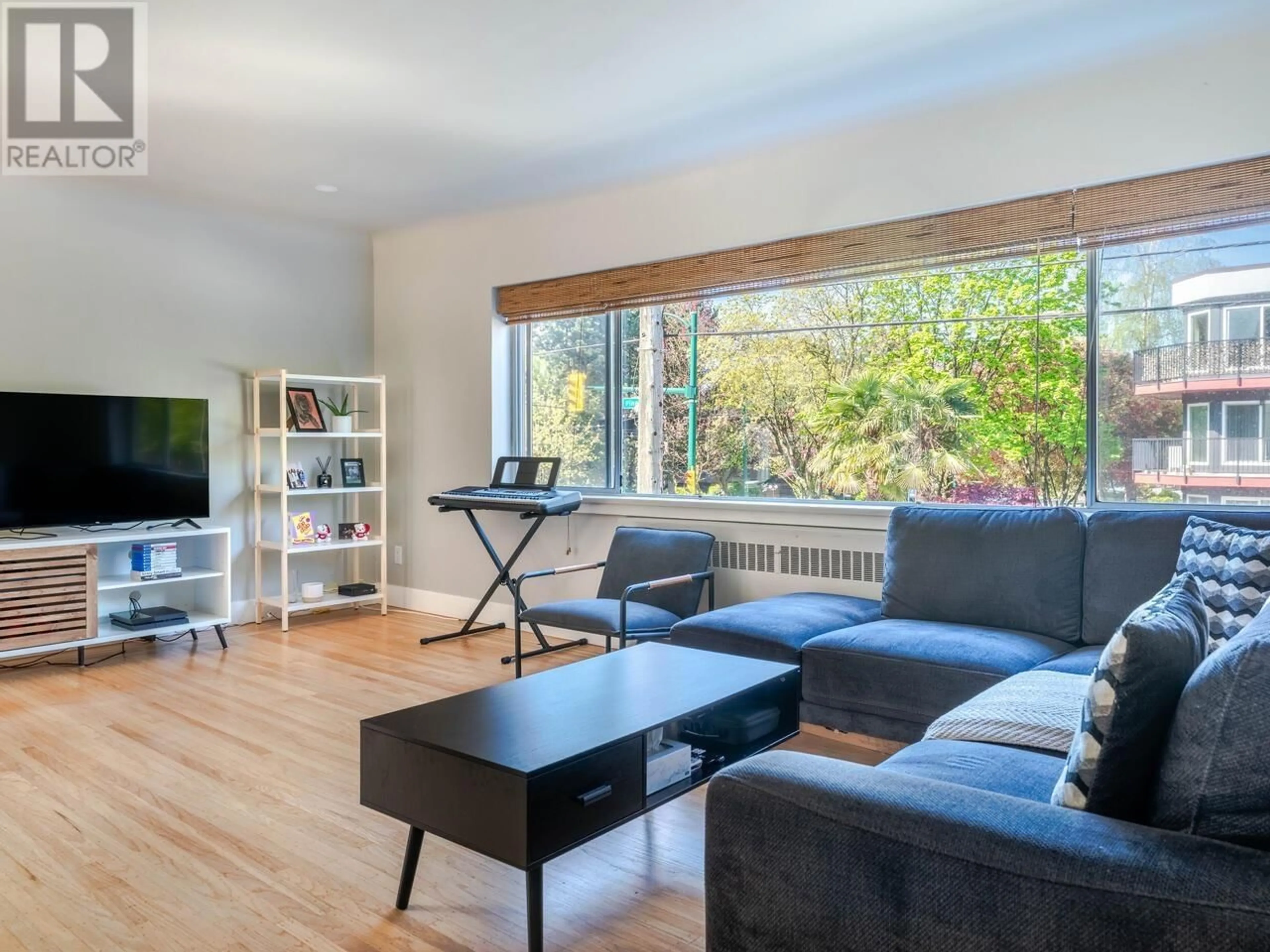 Living room with furniture, wood/laminate floor for 103 - 2776 PINE STREET, Vancouver British Columbia V6J3G2