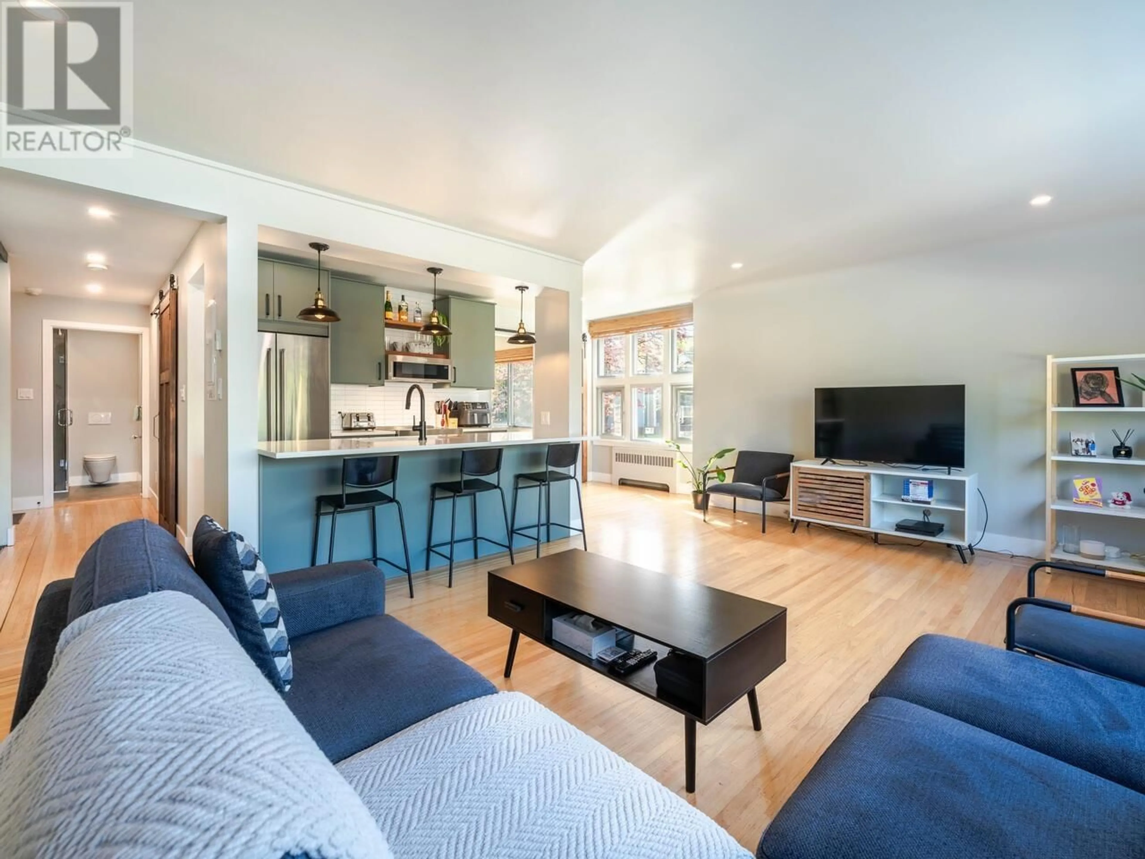 Living room with furniture, wood/laminate floor for 103 - 2776 PINE STREET, Vancouver British Columbia V6J3G2