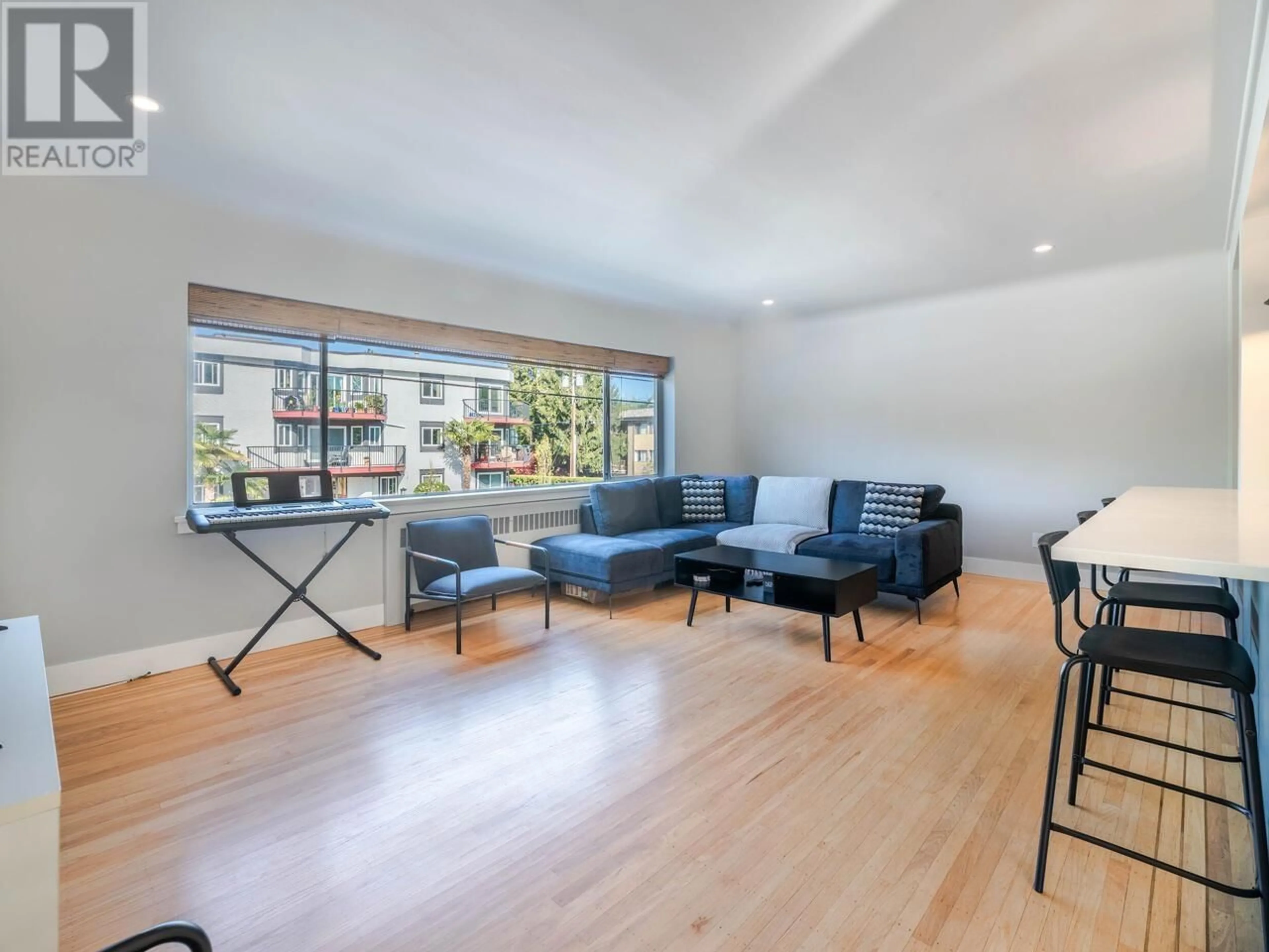 Living room with furniture, wood/laminate floor for 103 - 2776 PINE STREET, Vancouver British Columbia V6J3G2