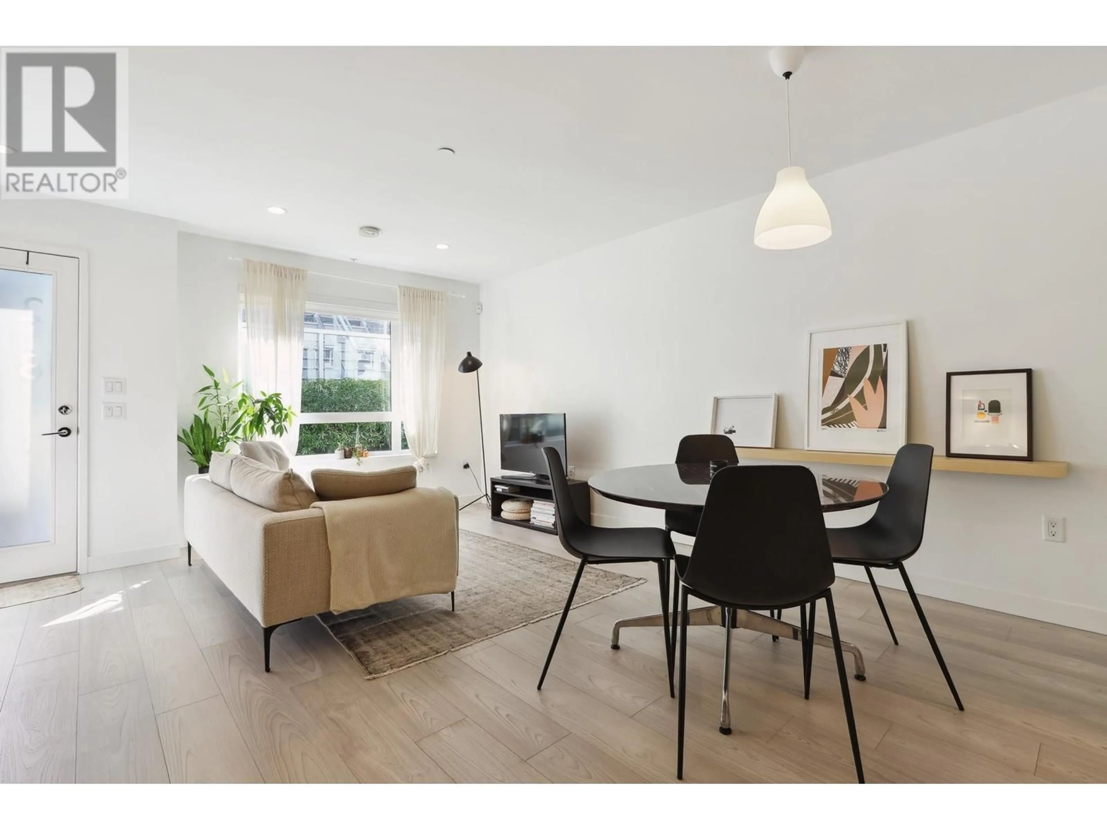 Living room with furniture, wood/laminate floor for 218 - 311 16 AVENUE, Vancouver British Columbia V5T2T7