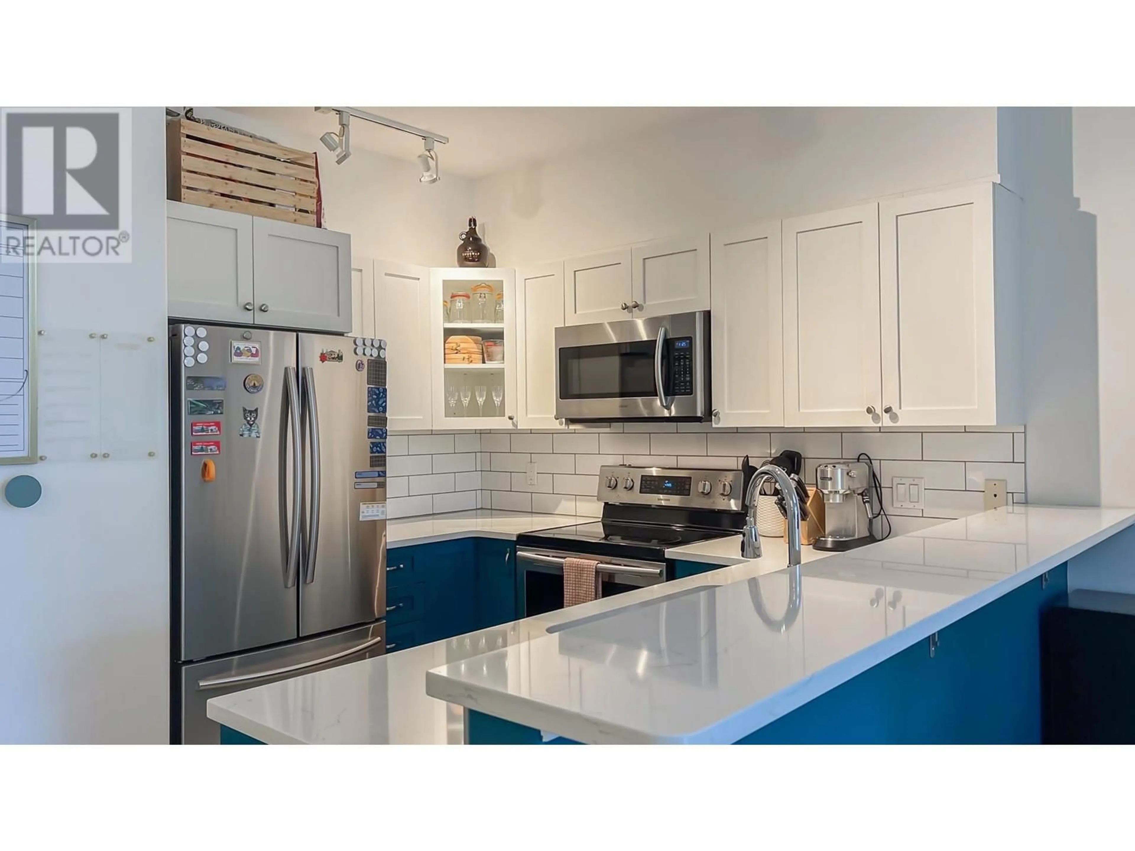 Open concept kitchen, ceramic/tile floor for 404 - 2755 MAPLE STREET, Vancouver British Columbia V6J5K1