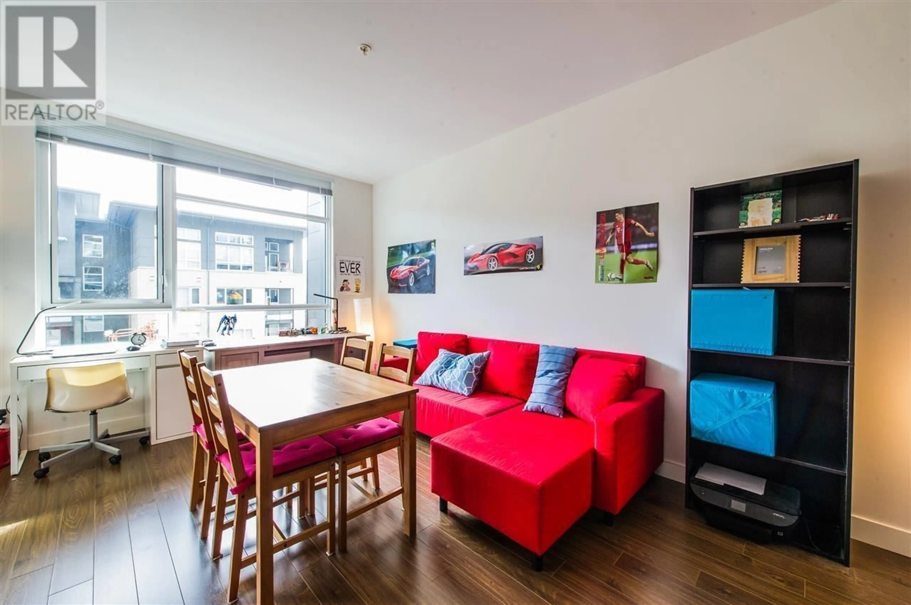 Living room with furniture, wood/laminate floor for 203 - 9150 UNIVERSITY HIGH STREET, Burnaby British Columbia V5A0C5