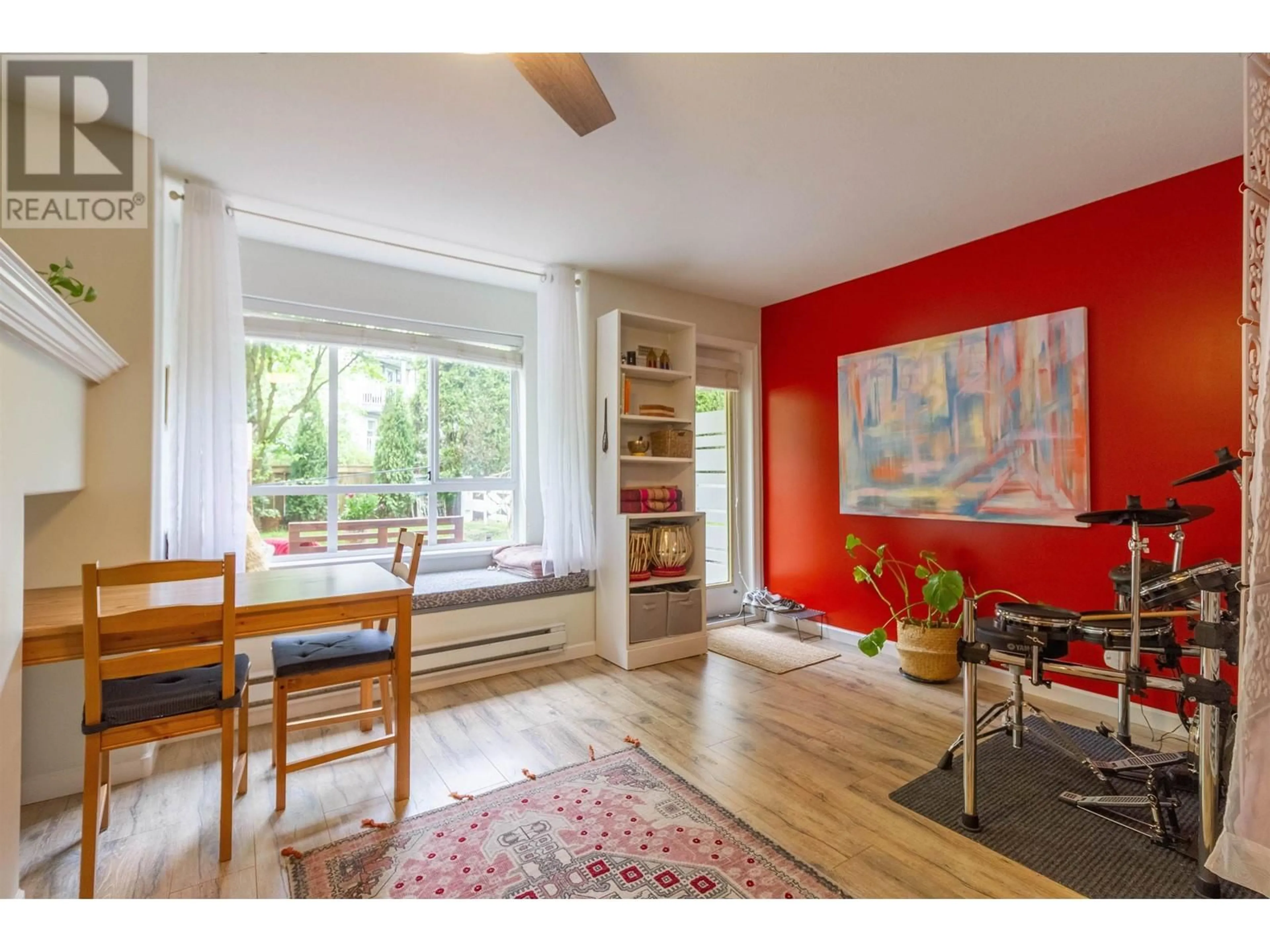 Living room with furniture, wood/laminate floor for 104 - 6745 STATION HILL COURT, Burnaby British Columbia V3N4Z4