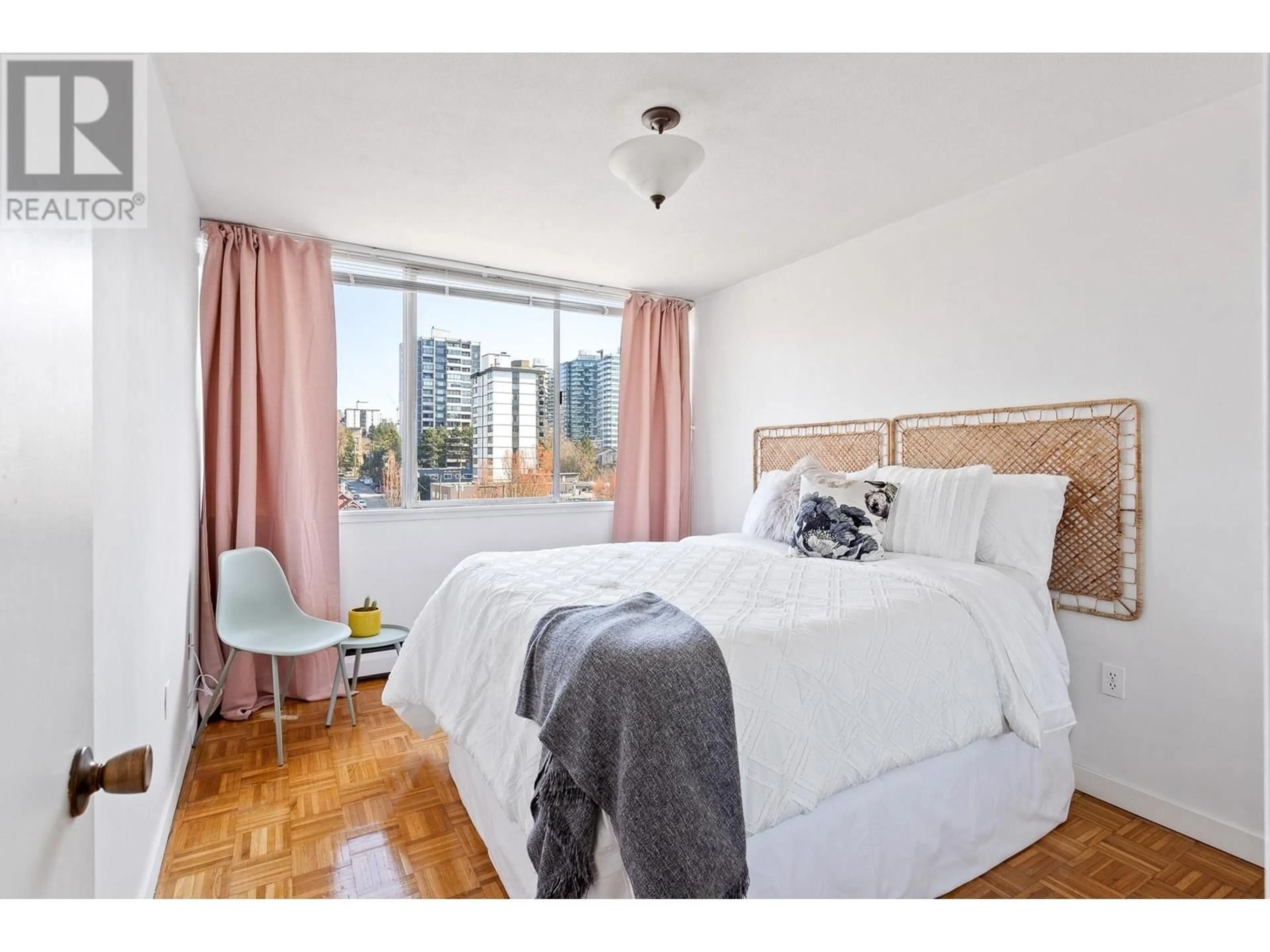 Bedroom with bed, wood/laminate floor for 601 - 1850 COMOX STREET, Vancouver British Columbia V6G1R3