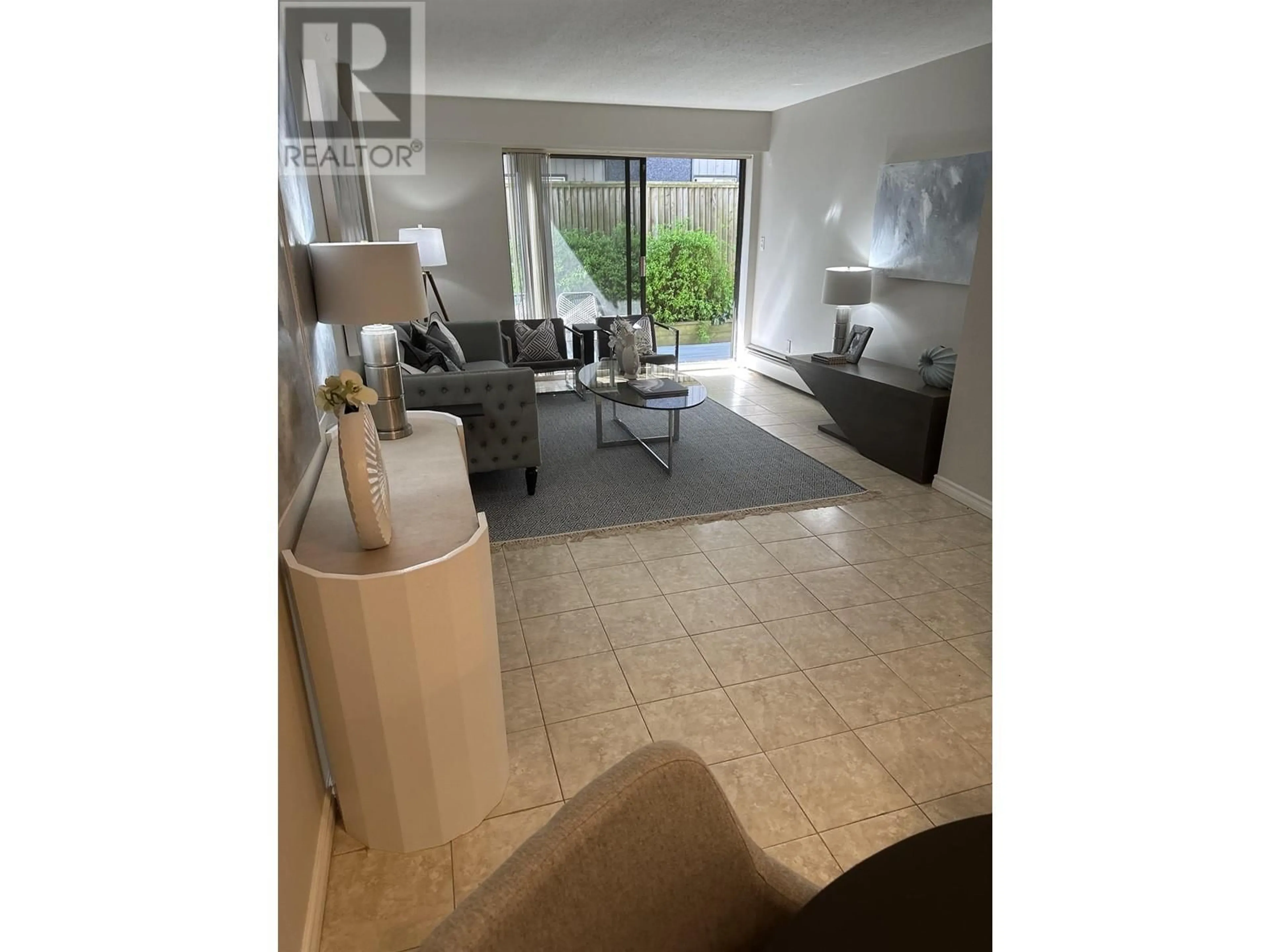 Living room with furniture, unknown for 103 - 2040 CORNWALL AVENUE, Vancouver British Columbia V6J1E1