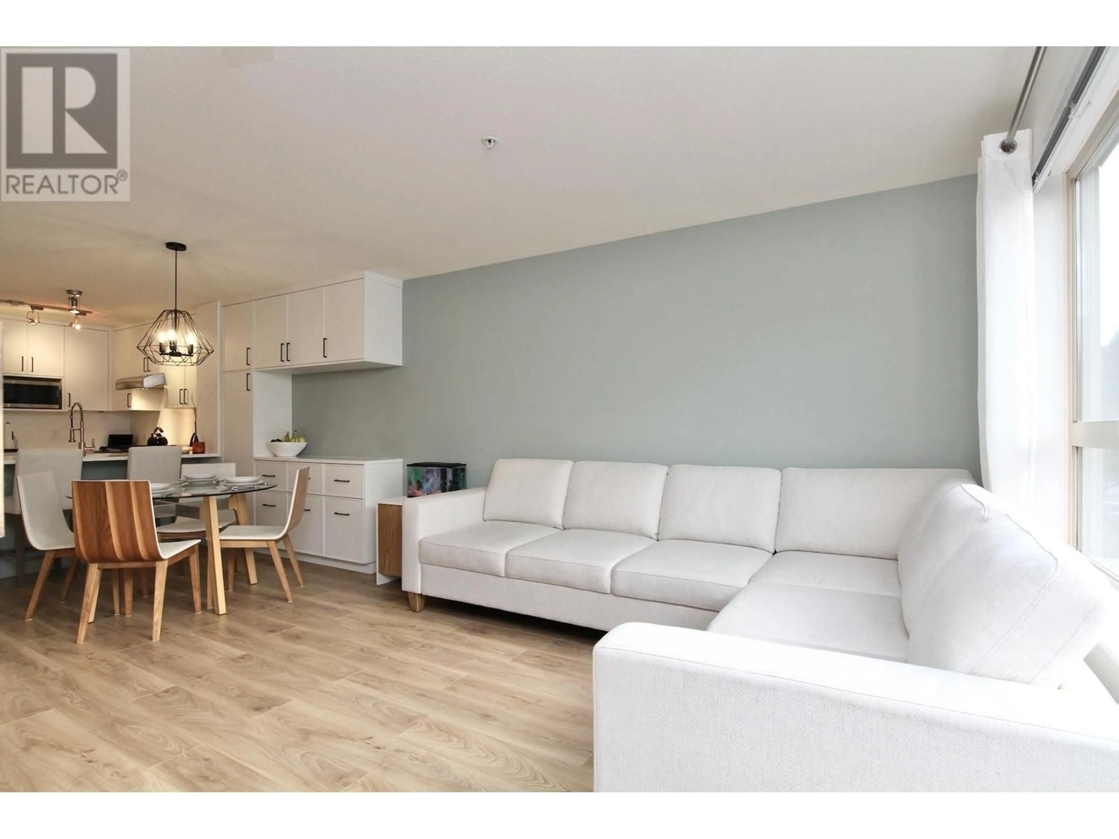 Living room with furniture, wood/laminate floor for 317 - 700 KLAHANIE DRIVE, Port Moody British Columbia V3H5L3