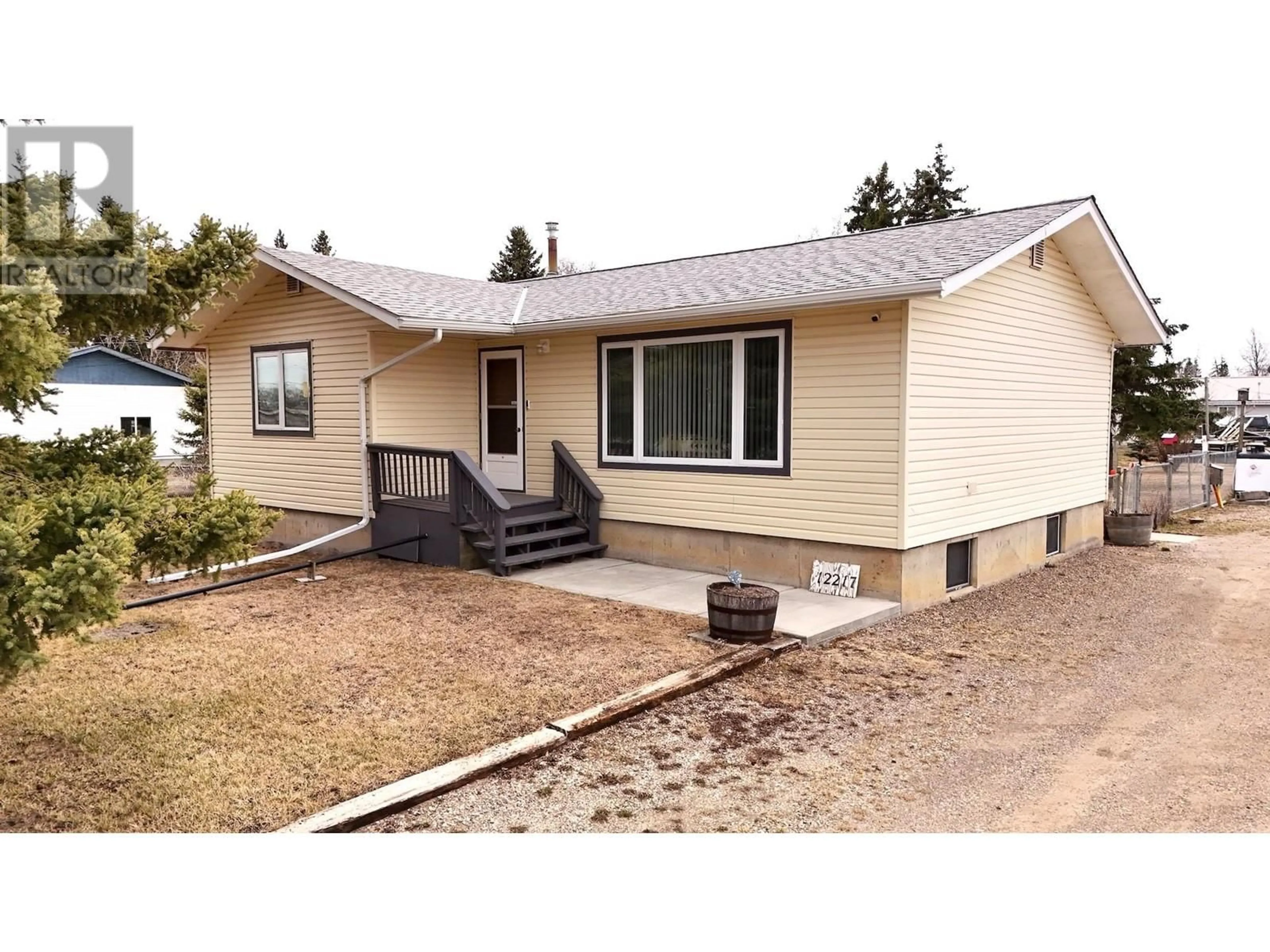 Home with vinyl exterior material, street for 12217 JUNIPER AVENUE, Fort St. John British Columbia V1J8E5