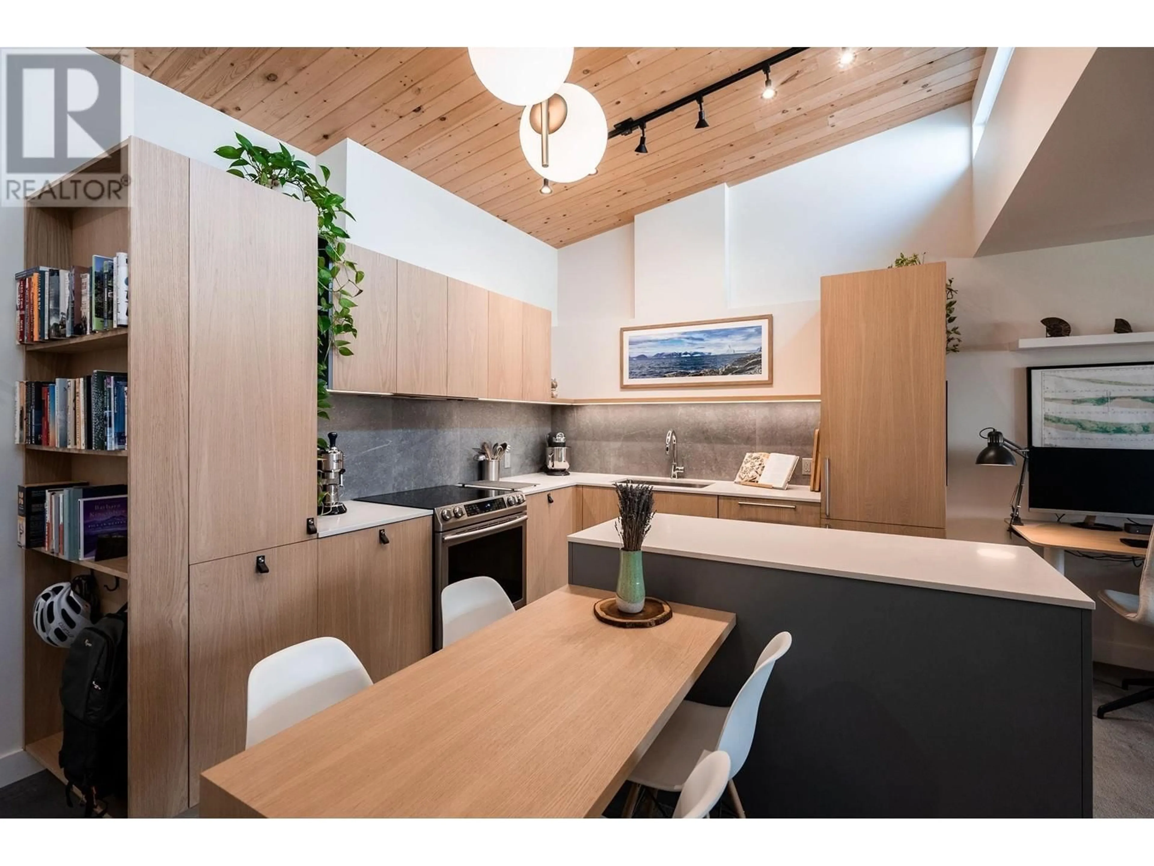 Open concept kitchen, wood/laminate floor for 301 - 2416 3RD AVENUE, Vancouver British Columbia V6K1L8