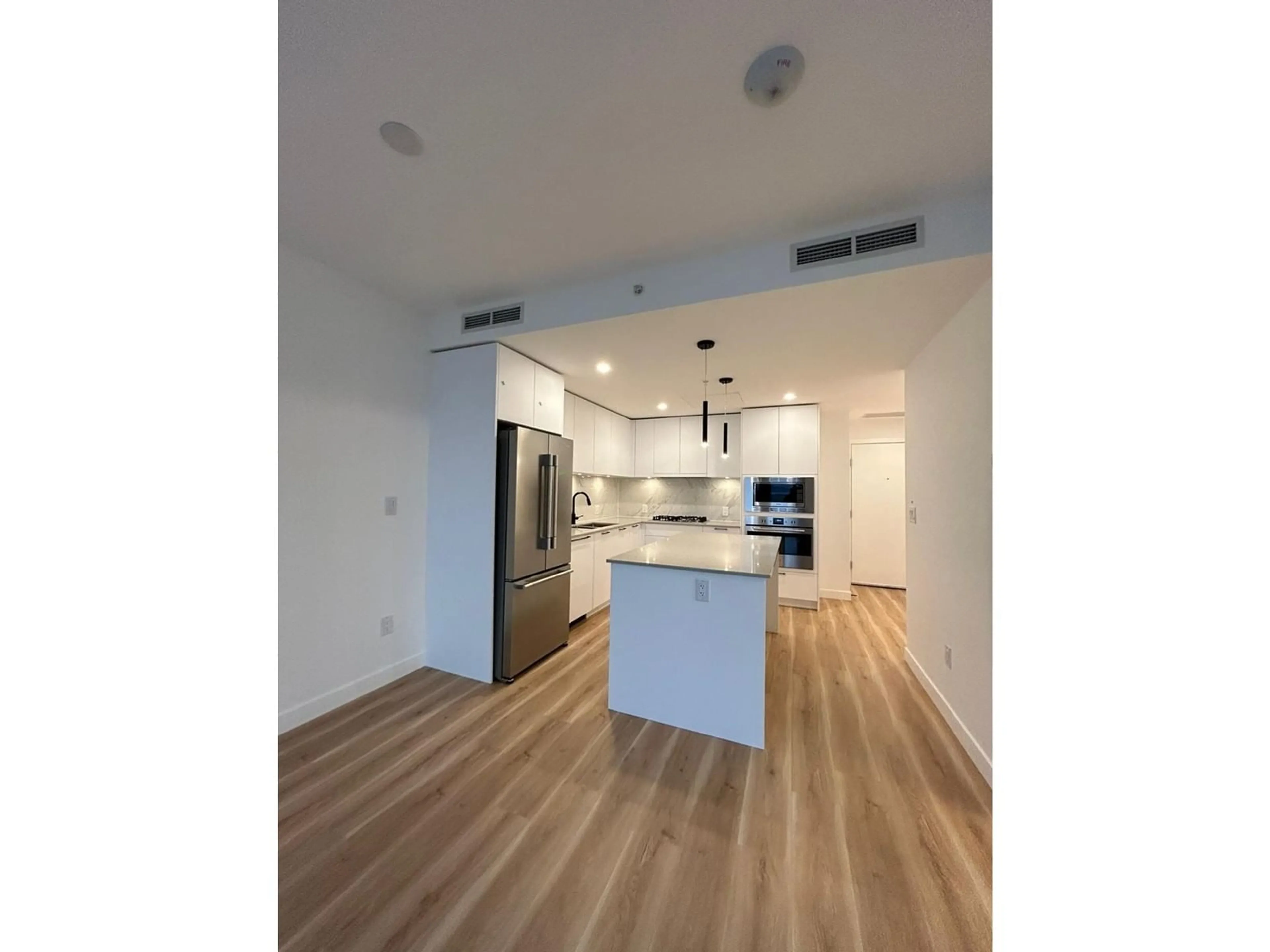 Open concept kitchen, wood/laminate floor for 2503 - 8551 201, Langley British Columbia V2Y3Y5
