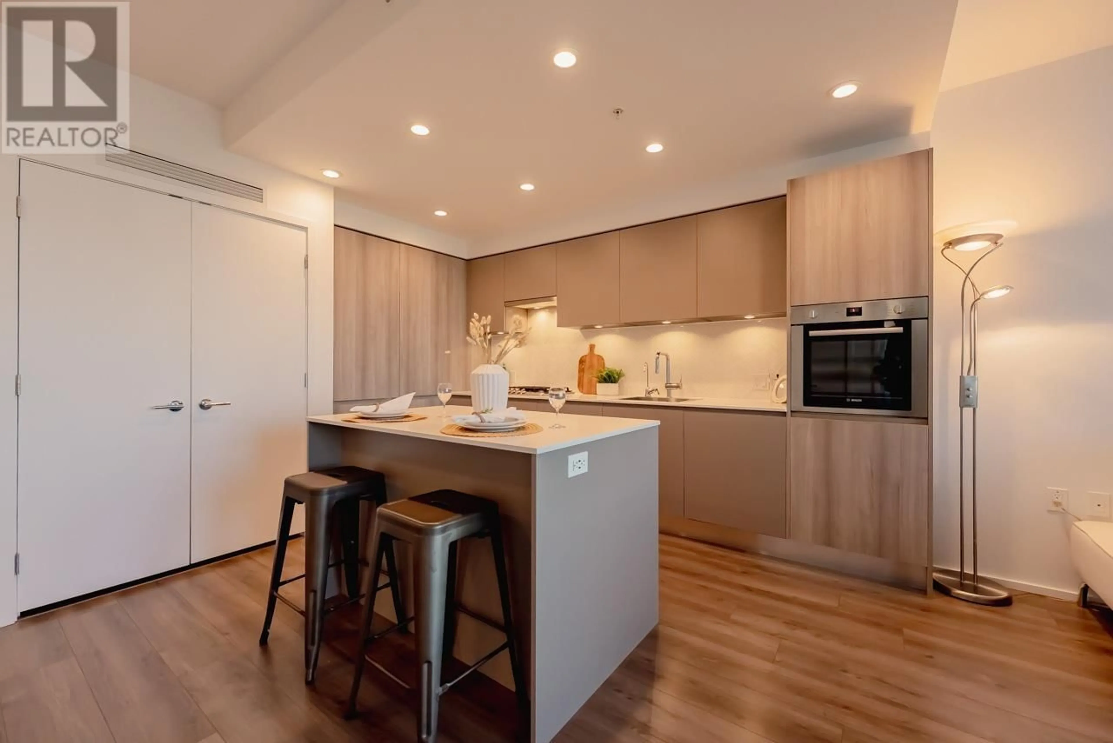 Open concept kitchen, wood/laminate floor for 1302 - 3809 EVERGREEN PLACE, Burnaby British Columbia V3J0M1