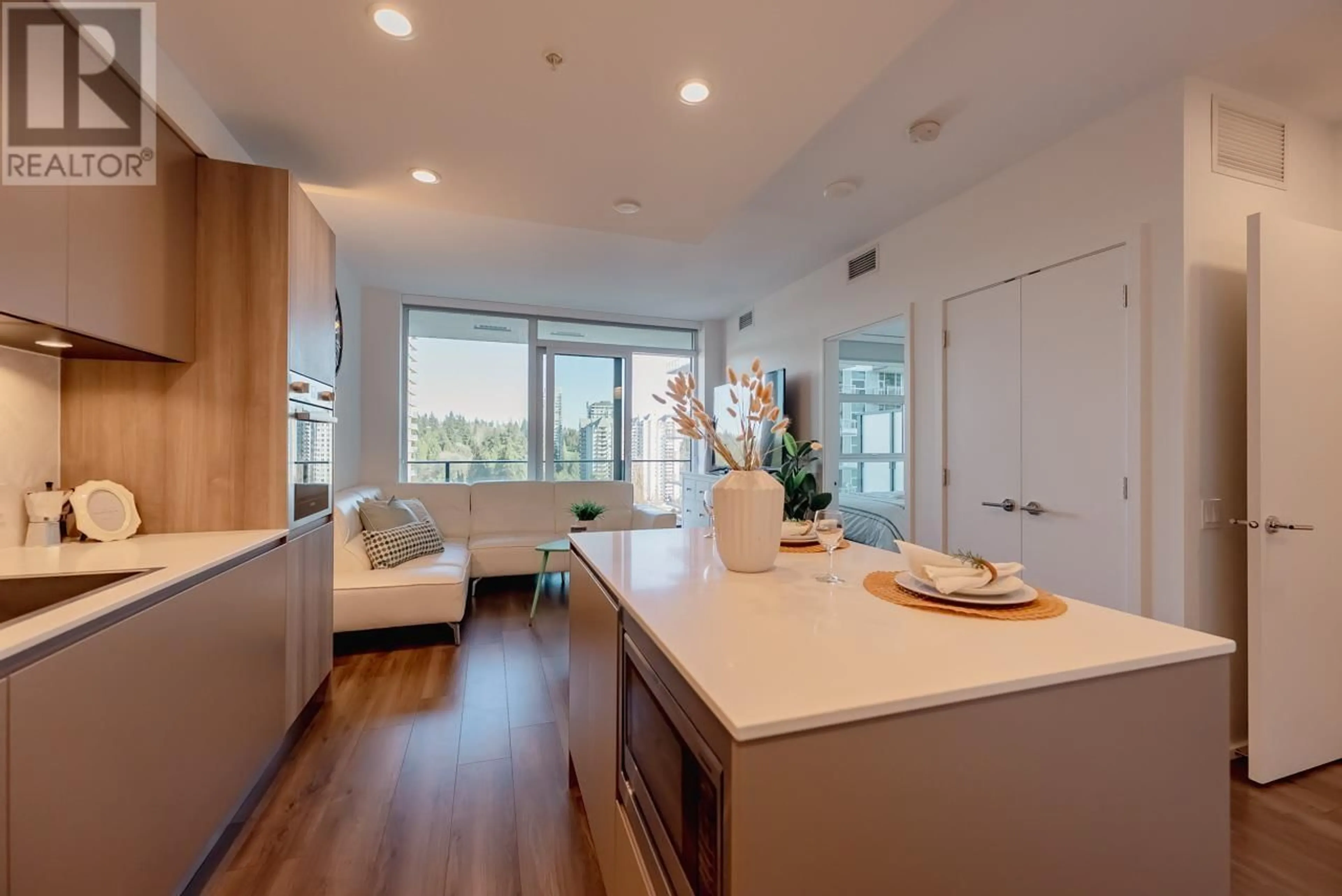 Open concept kitchen, wood/laminate floor for 1302 - 3809 EVERGREEN PLACE, Burnaby British Columbia V3J0M1