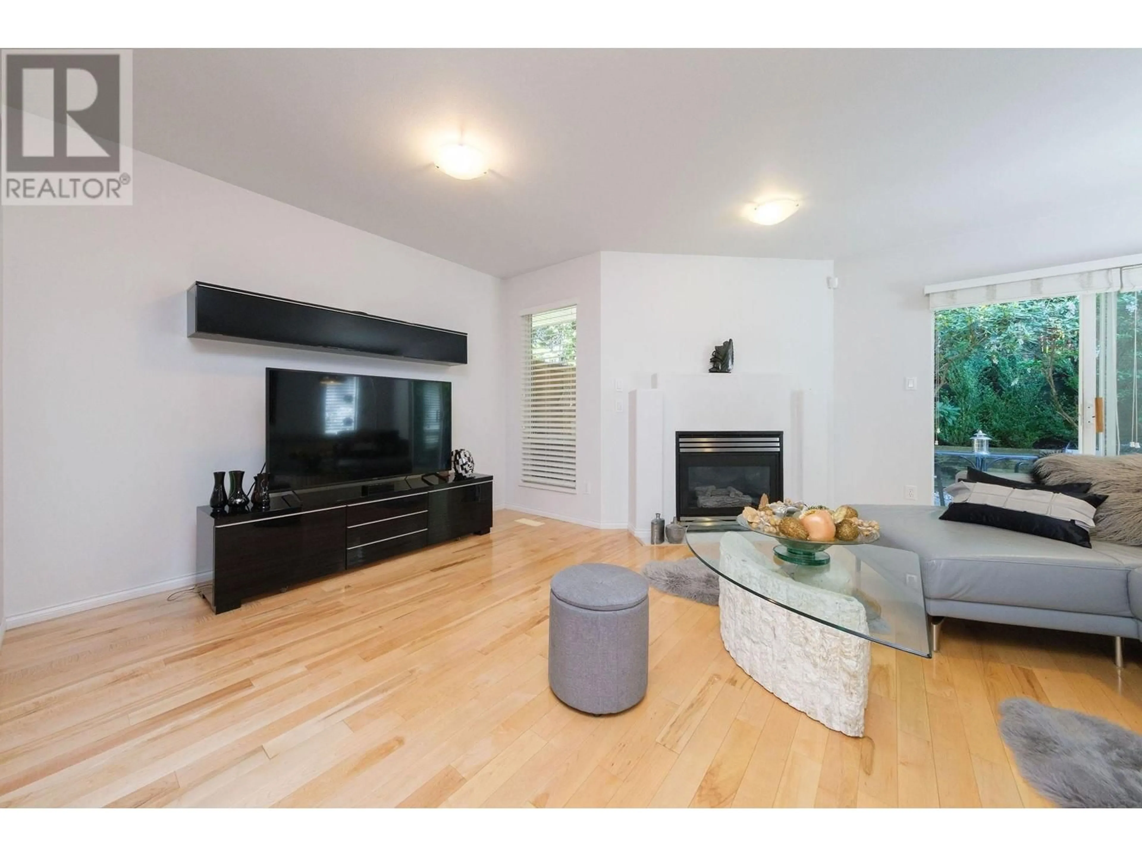 Living room with furniture, wood/laminate floor for 23 - 8701 16TH AVENUE, Burnaby British Columbia V3N5B5