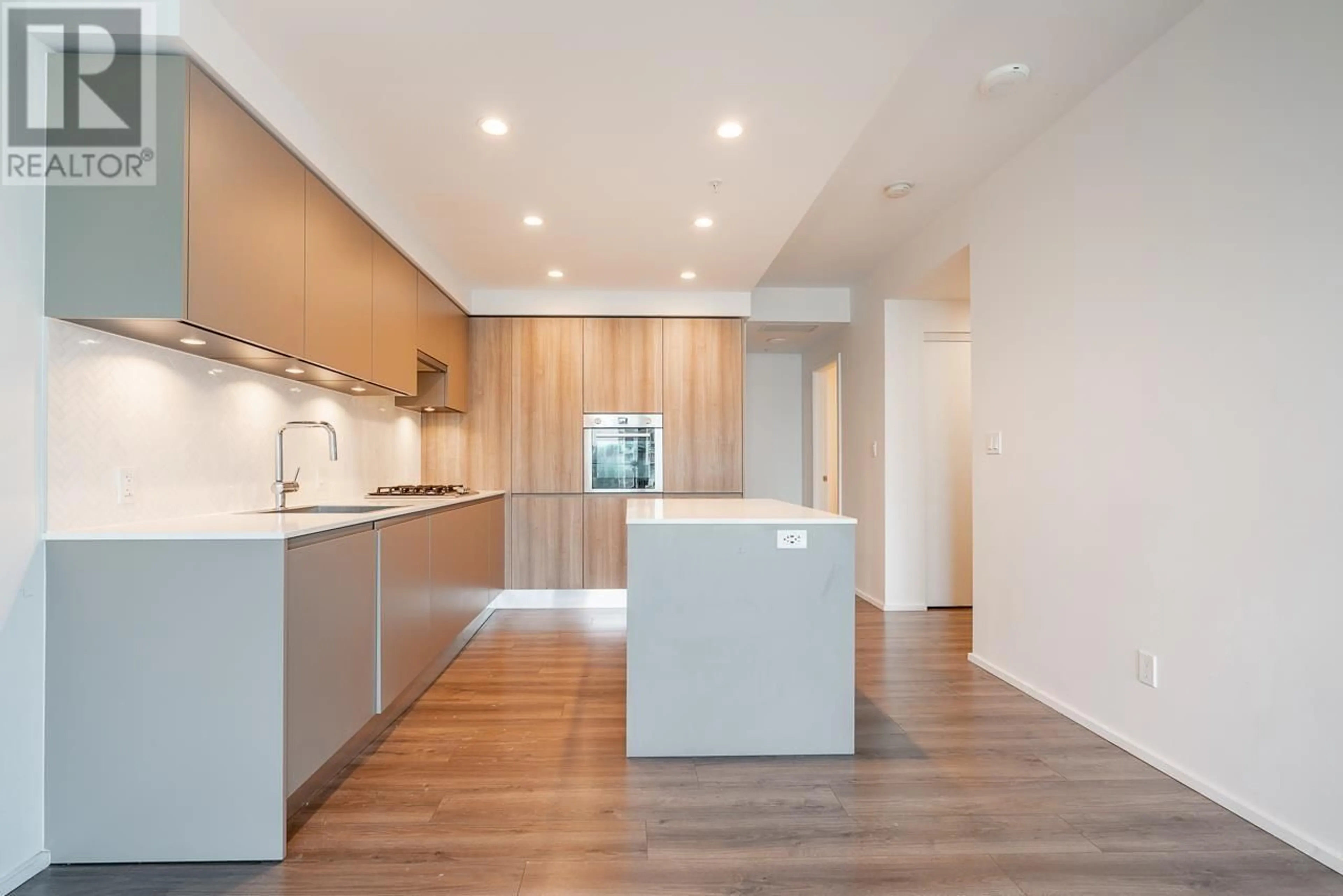 Open concept kitchen, wood/laminate floor for 2111 - 3809 EVERGREEN PLACE, Burnaby British Columbia V3J0M1
