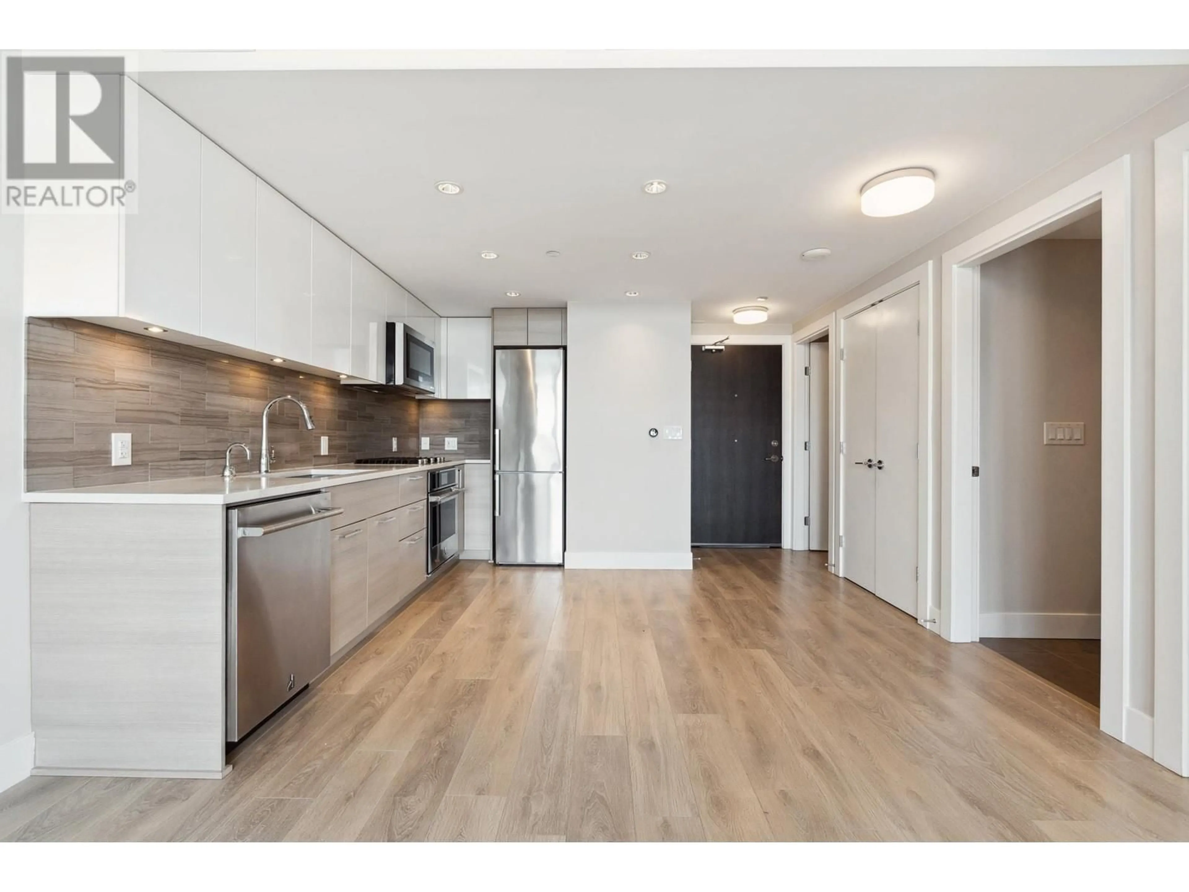 Open concept kitchen, wood/laminate floor for 1104 - 8533 RIVER DISTRICT CROSSING, Vancouver British Columbia V5S0H2