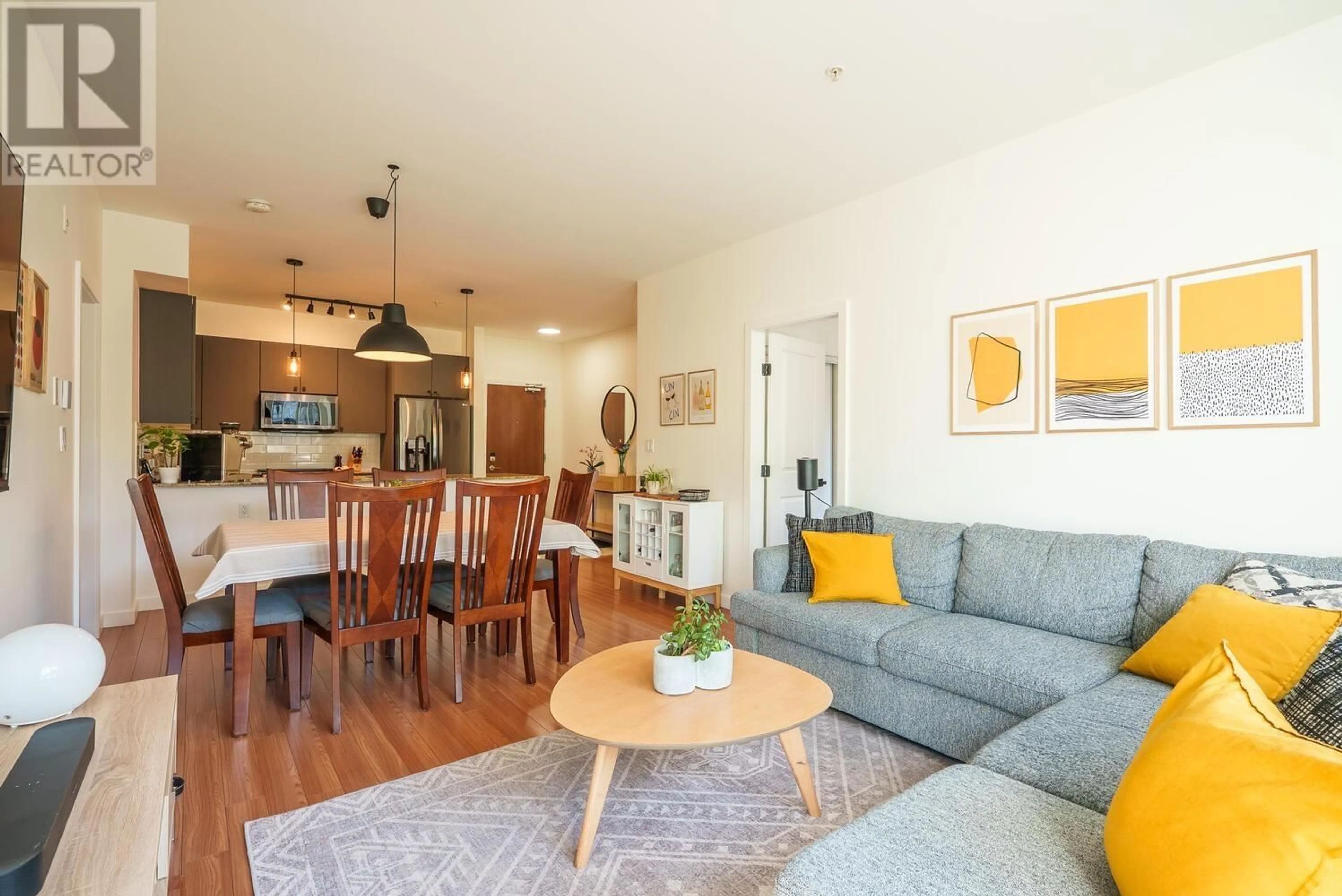 Living room with furniture, wood/laminate floor for 314 - 225 FRANCIS WAY, New Westminster British Columbia V3L0G1