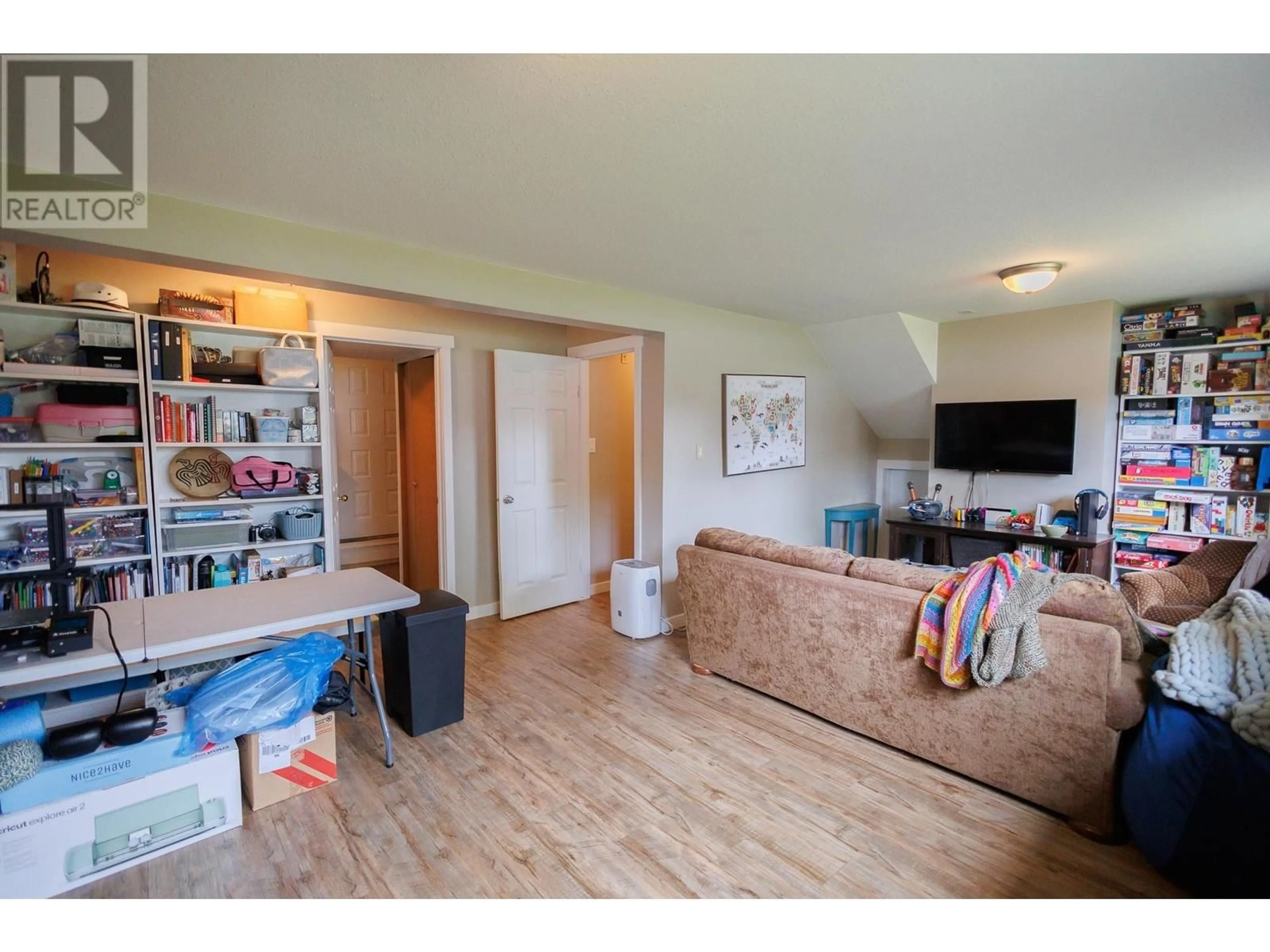 Living room with furniture, wood/laminate floor for 4922 LAMBLY AVENUE, Terrace British Columbia V8G4N5