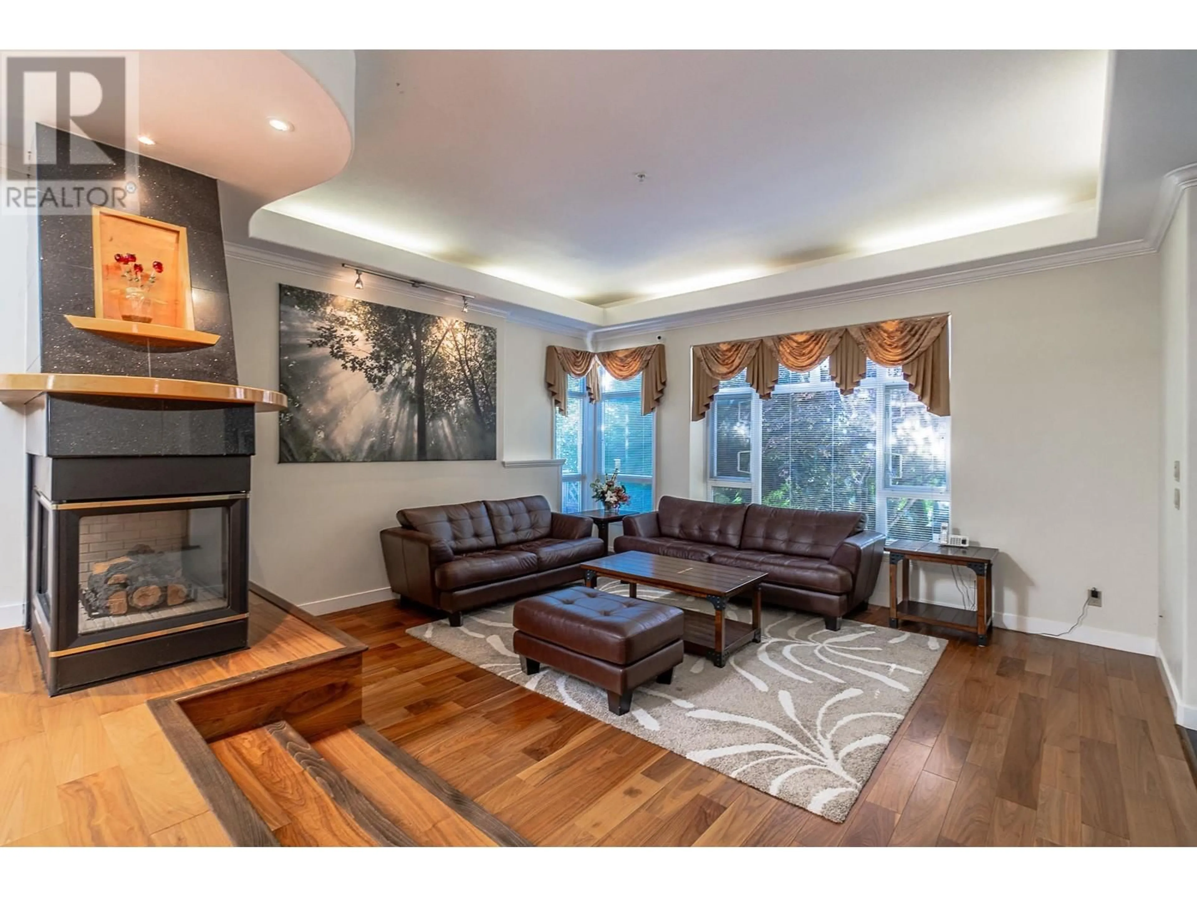 Living room with furniture, wood/laminate floor for 7736 JASPER CRESCENT, Vancouver British Columbia V5P3S9