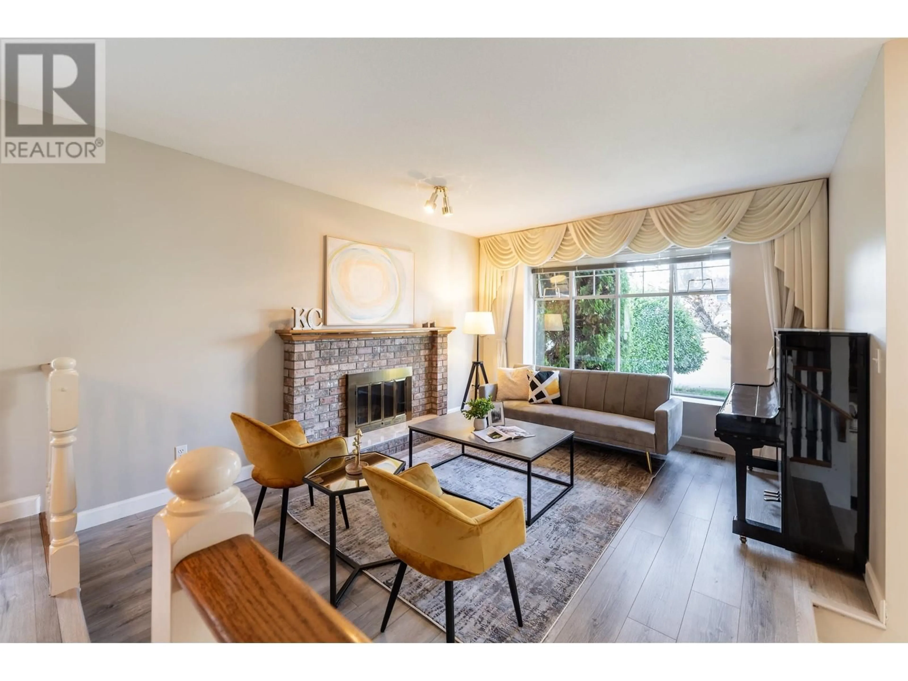 Living room with furniture, wood/laminate floor for 1936 EUREKA AVENUE, Port Coquitlam British Columbia V3C5P5