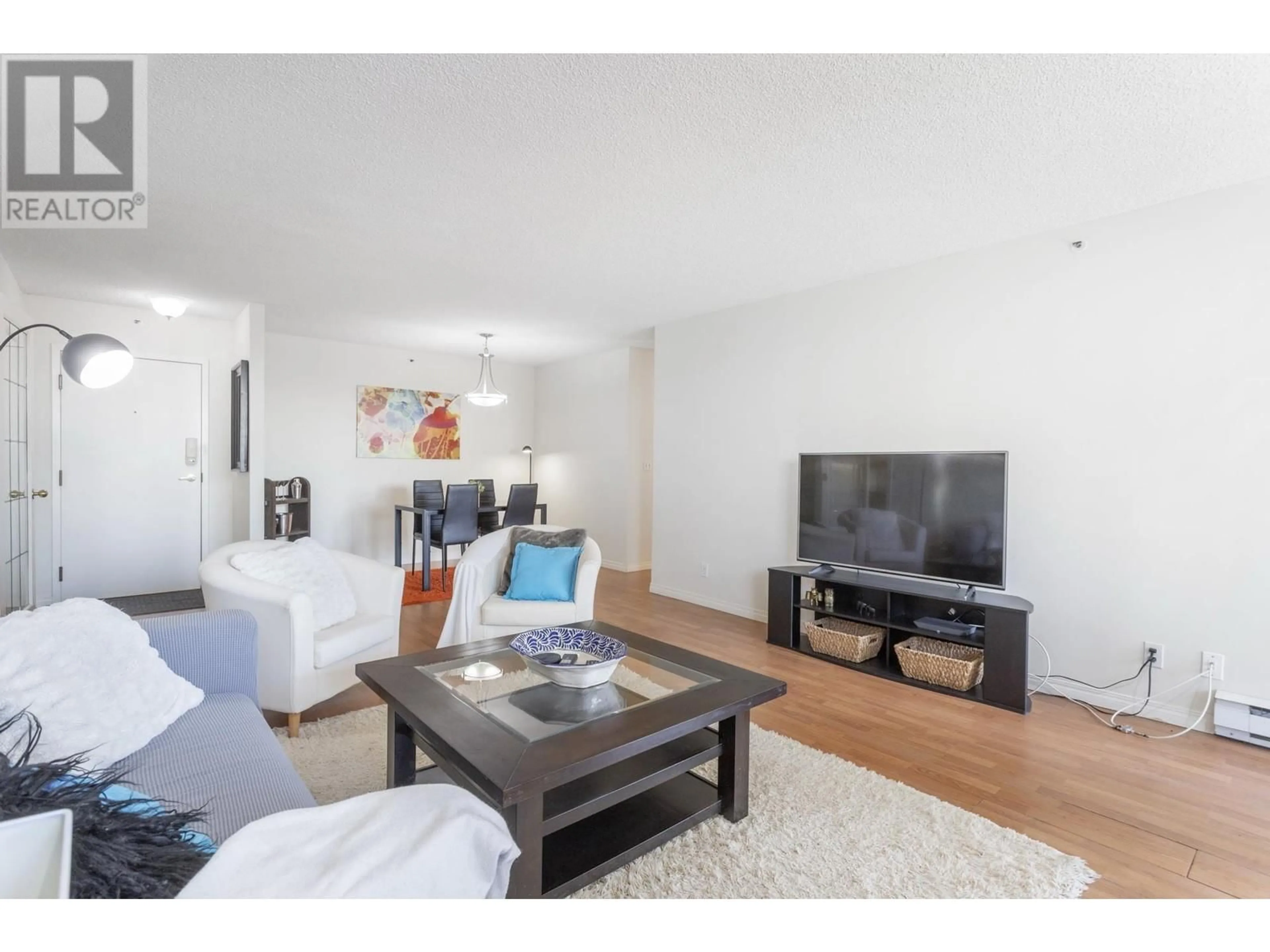Living room with furniture, wood/laminate floor for 301 - 551 AUSTIN AVENUE, Coquitlam British Columbia V3K6R7
