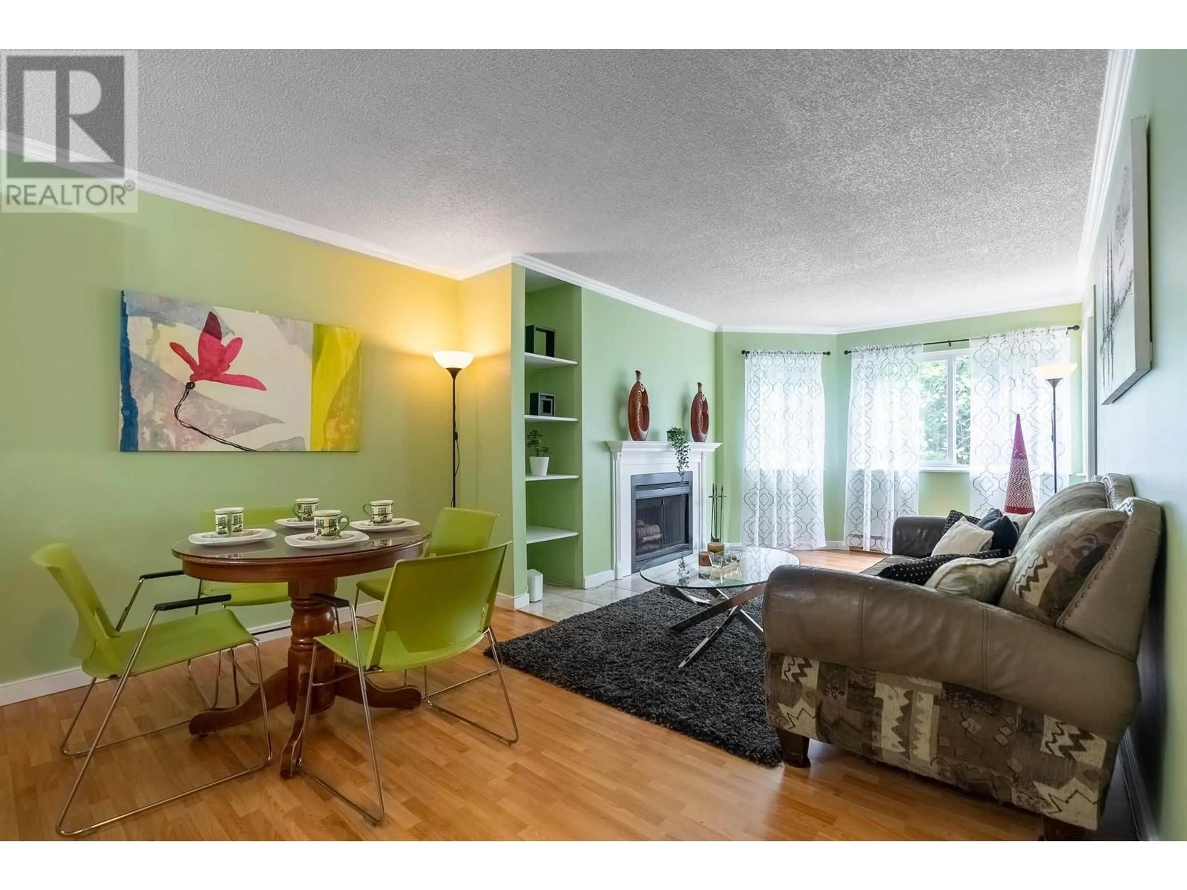 Living room with furniture, wood/laminate floor for 402 - 9880 MANCHESTER DRIVE, Burnaby British Columbia V3N4R3