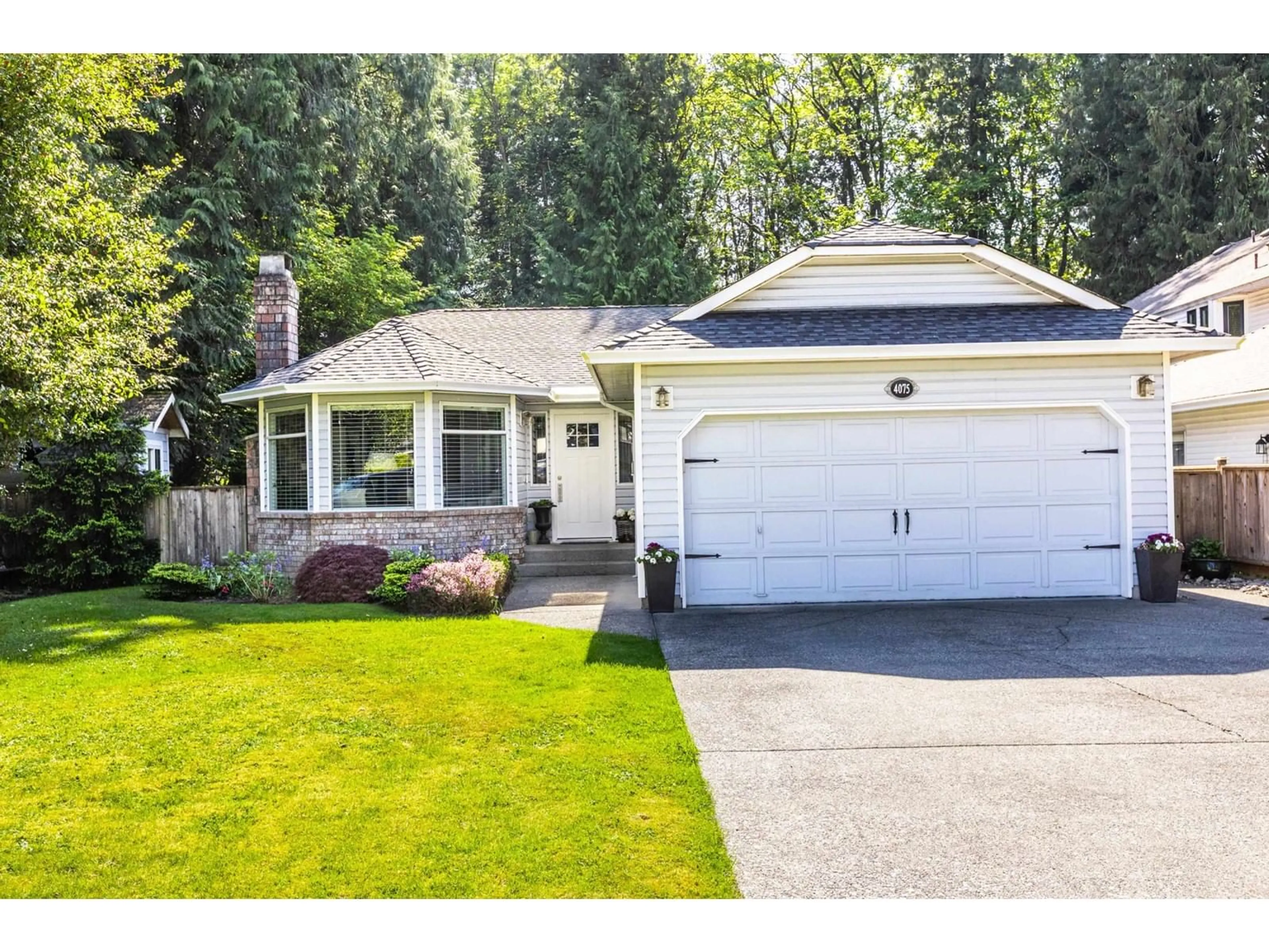 Home with vinyl exterior material, street for 4075 199A, Langley British Columbia V3A7S8
