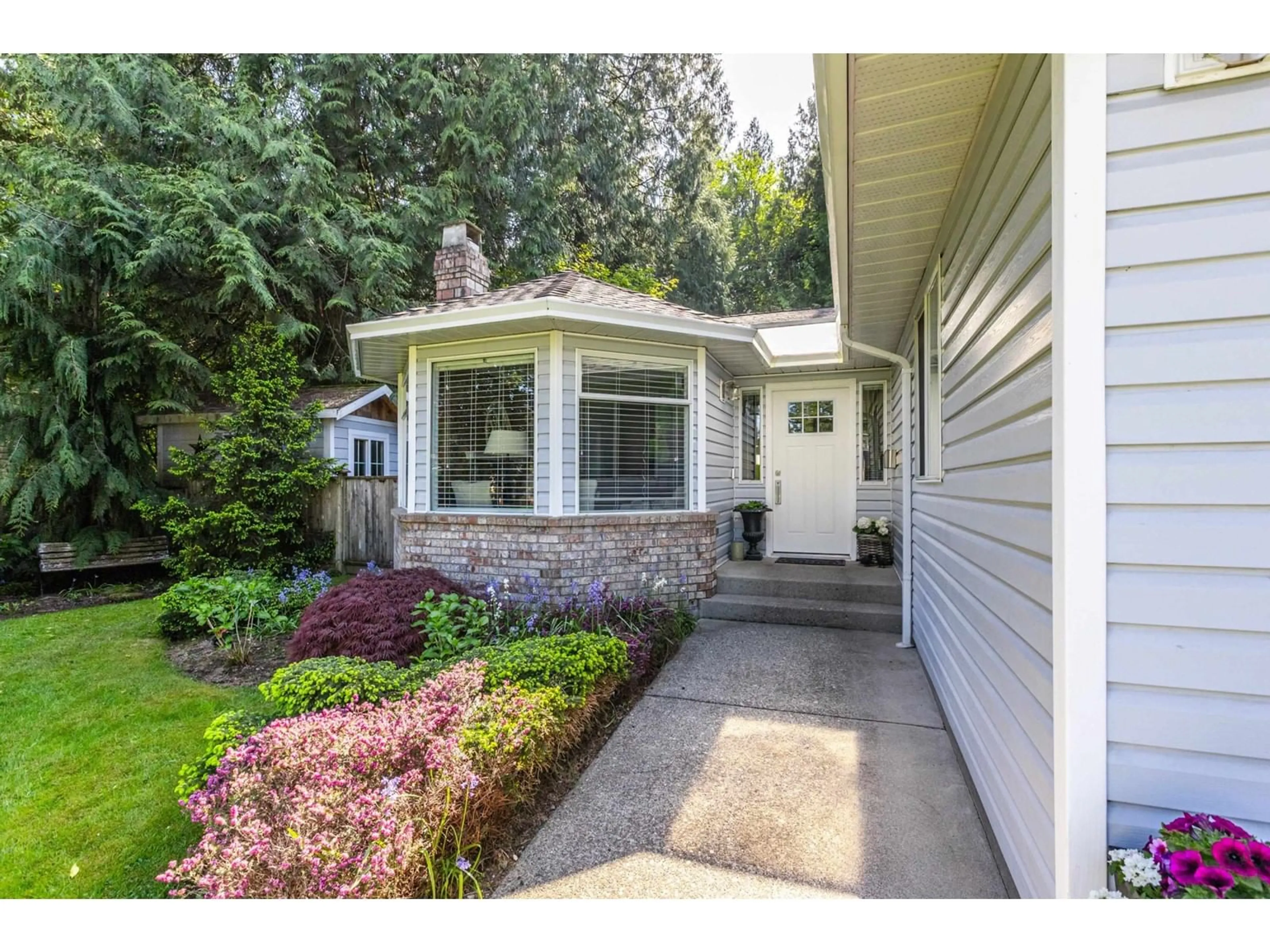 Home with vinyl exterior material, street for 4075 199A, Langley British Columbia V3A7S8