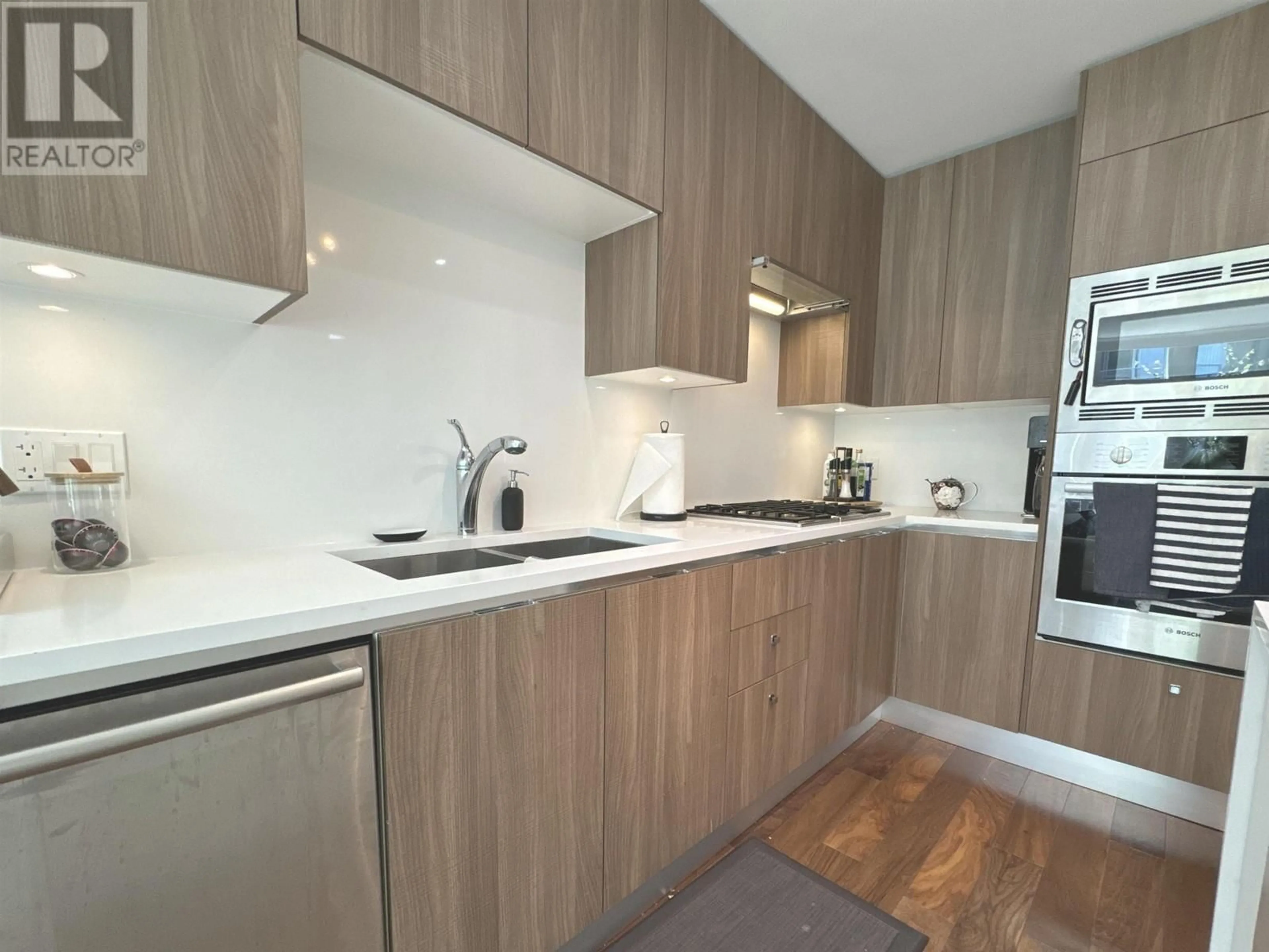 Standard kitchen, wood/laminate floor for 202 - 185 VICTORY SHIP WAY, Vancouver British Columbia V7L0G2
