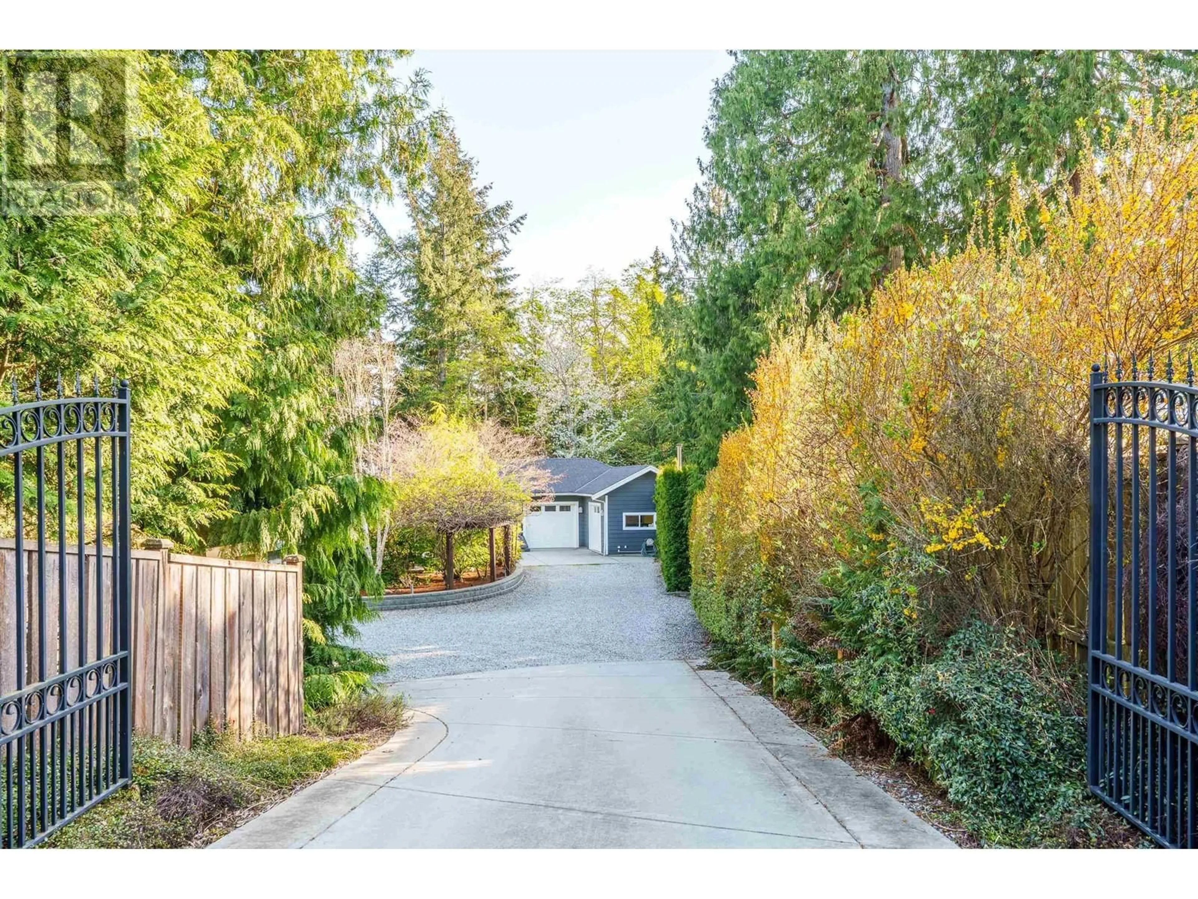 A pic from outside/outdoor area/front of a property/back of a property/a pic from drone, street for 6323 ORACLE ROAD, Sechelt British Columbia V7Z0R8
