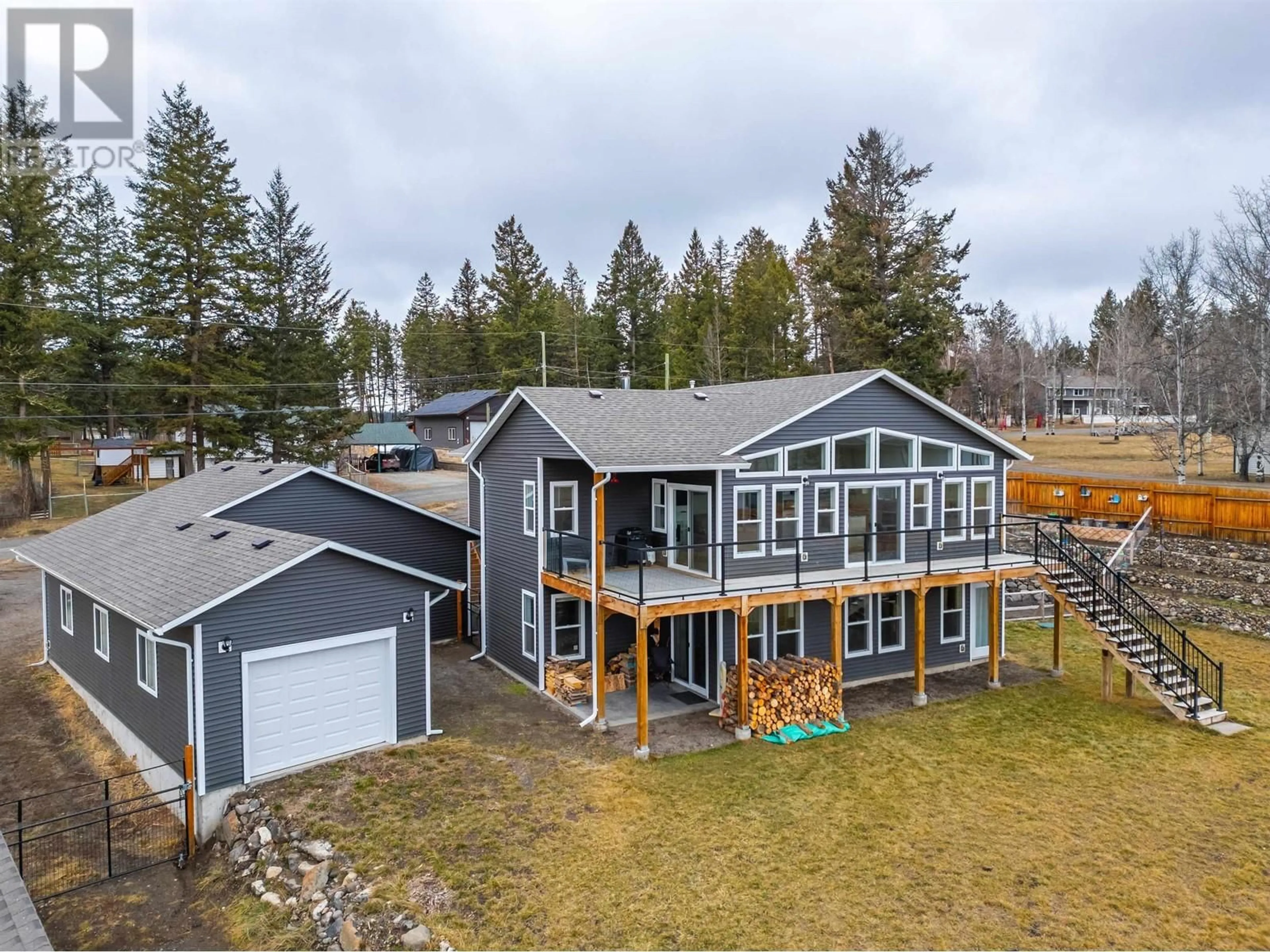 A pic from outside/outdoor area/front of a property/back of a property/a pic from drone, water/lake/river/ocean view for 5066 BLOCK DRIVE, 108 Mile Ranch British Columbia V0K2E0