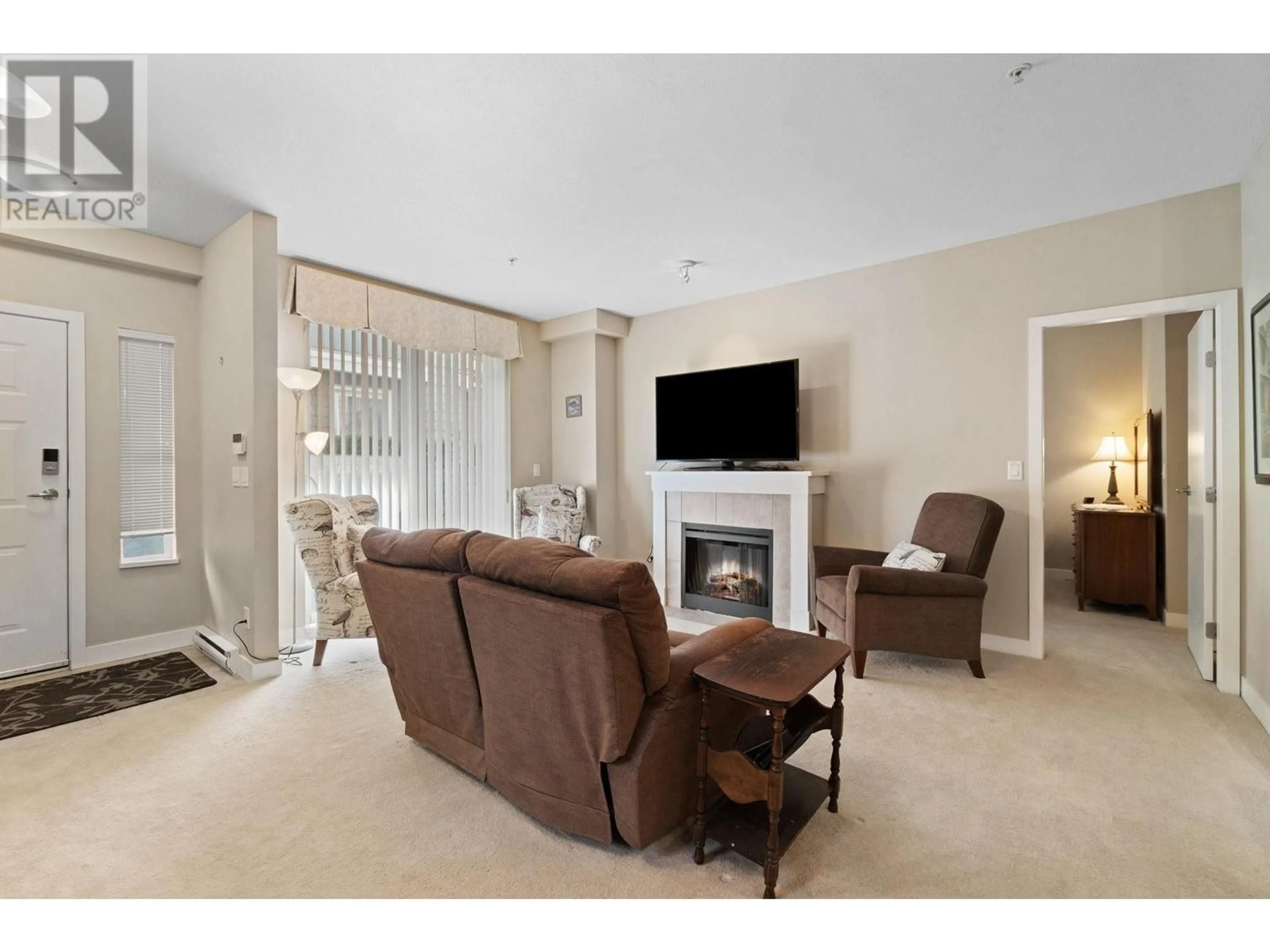 Living room with furniture, unknown for 7032 MONT ROYAL SQUARE, Vancouver British Columbia V5S4X5