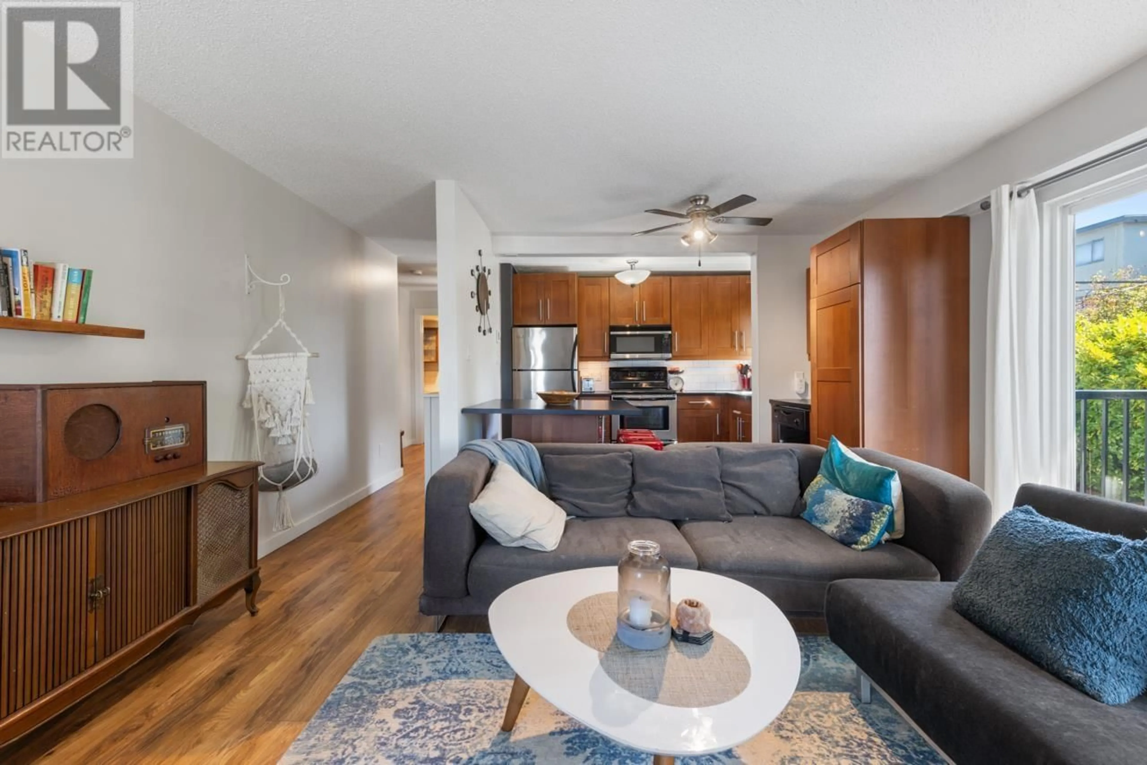 Living room with furniture, wood/laminate floor for 204 - 2244 MCGILL STREET, Vancouver British Columbia V5L1C4