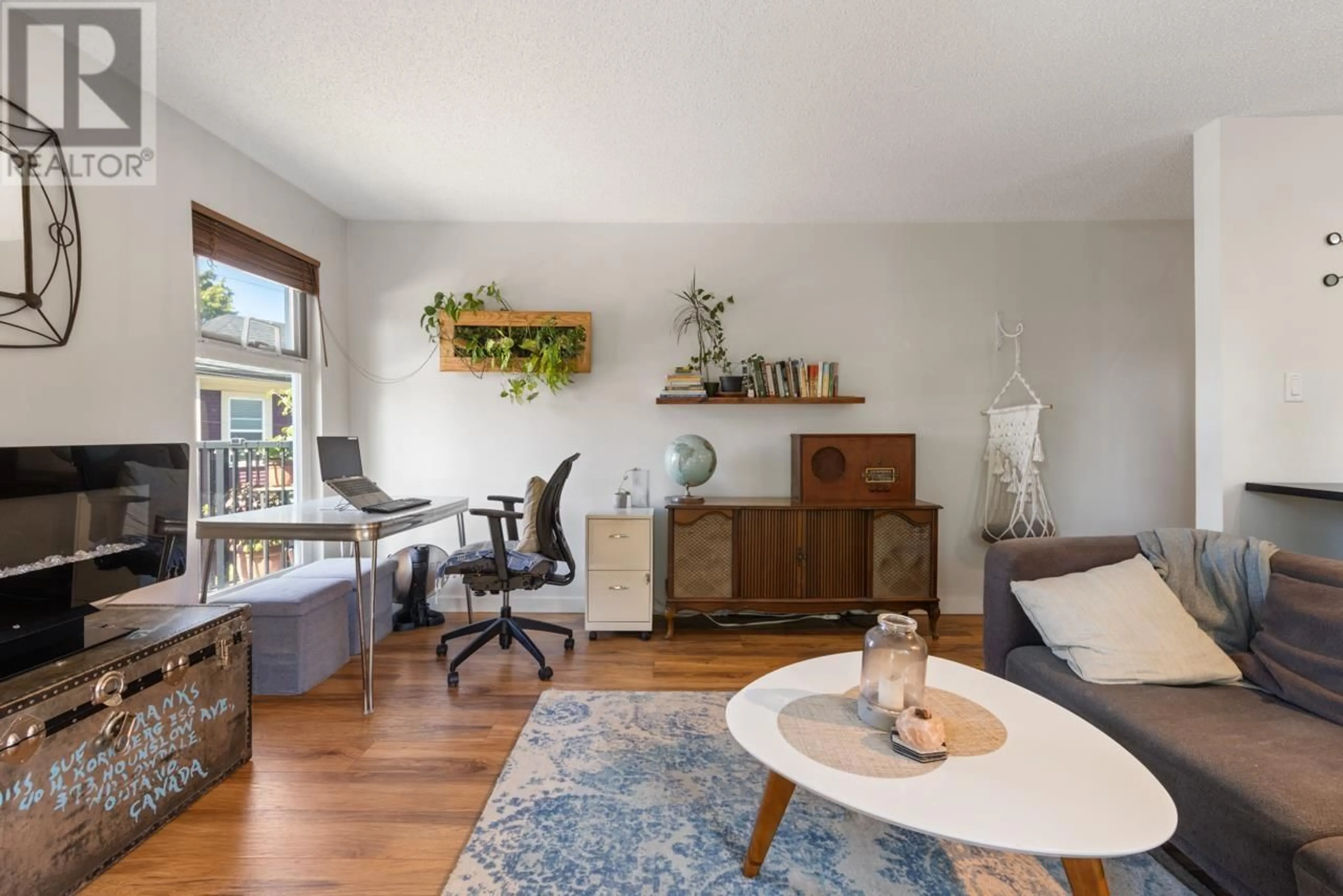 Living room with furniture, wood/laminate floor for 204 - 2244 MCGILL STREET, Vancouver British Columbia V5L1C4